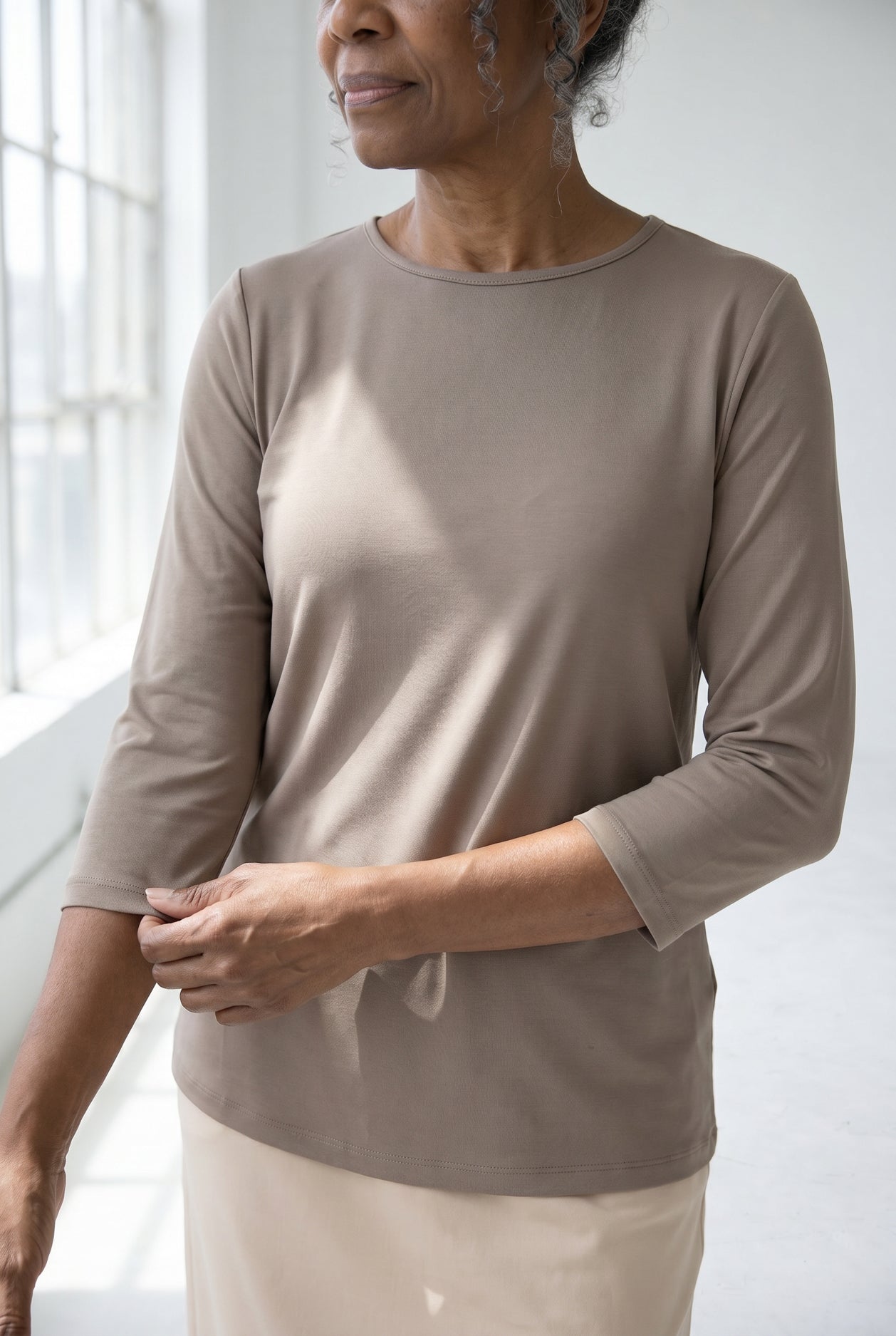 Model wearing Nuggles® Half Sleeve Essential Tee in Taupe