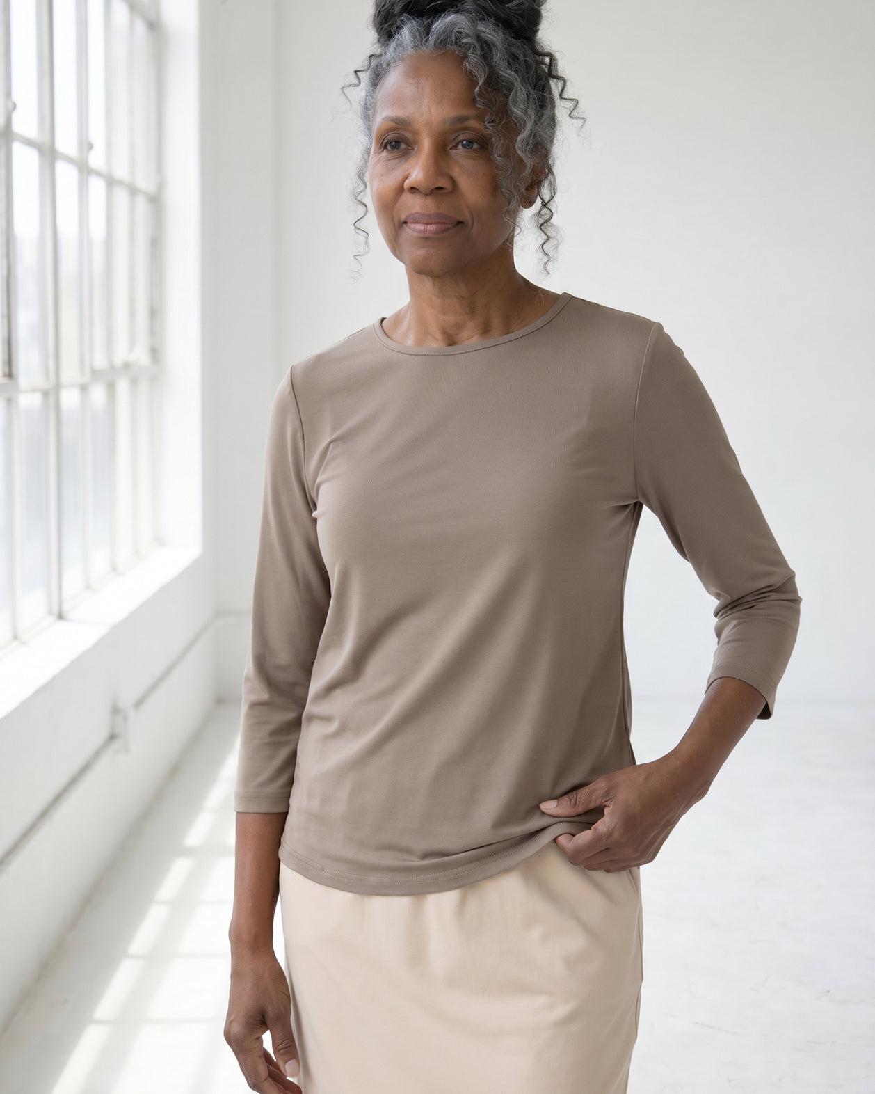 Model wearing Nuggles® Half Sleeve Essential Tee in Taupe