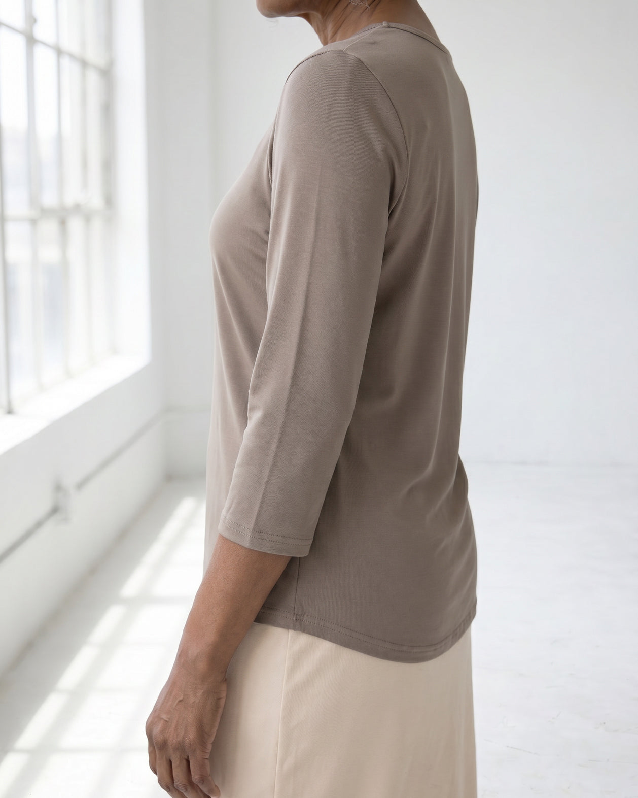 Model wearing Nuggles® Half Sleeve Essential Tee in Taupe