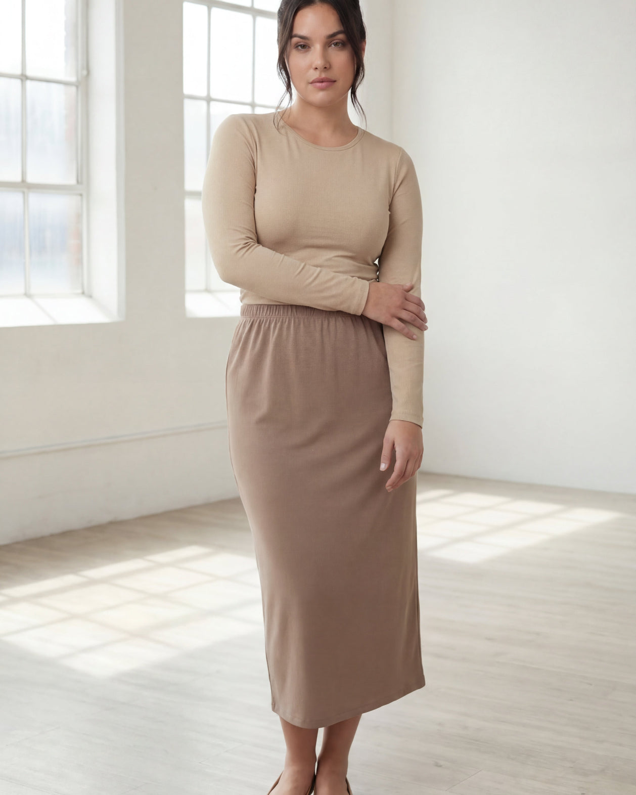 Model wearing Nuggles® 31" Classic Skirt in Taupe