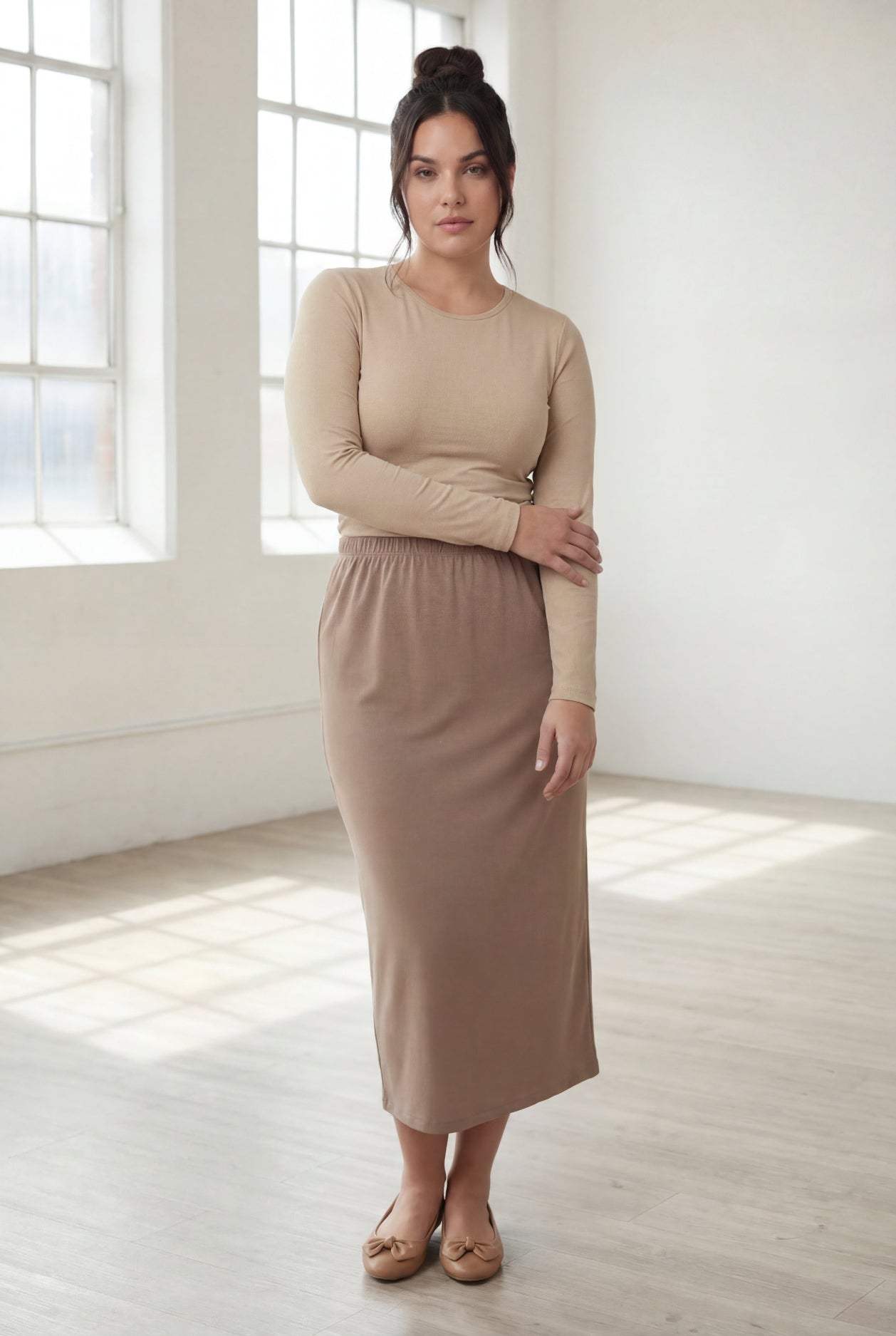 Model wearing Nuggles® 31" Classic Skirt in Taupe
