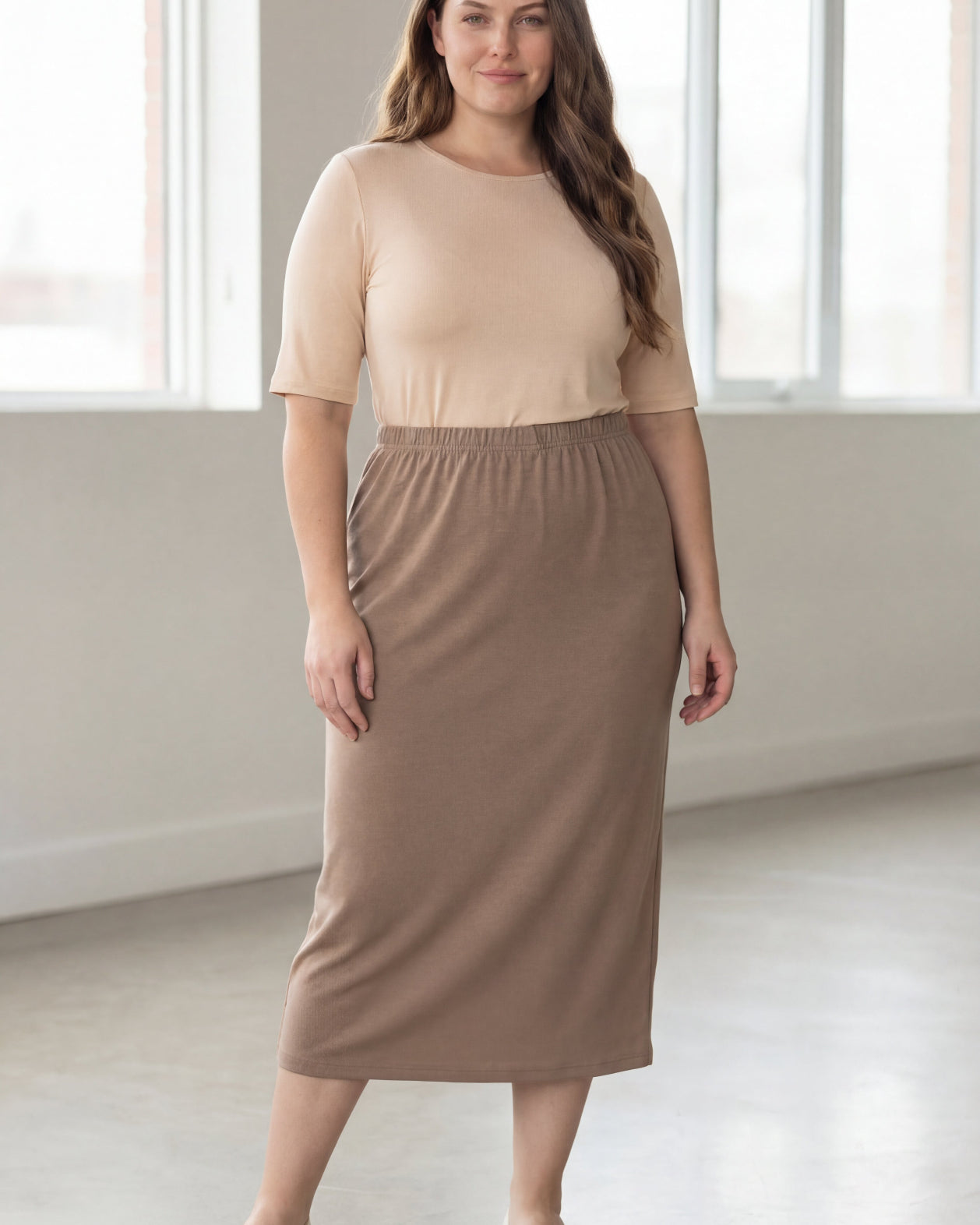 Model wearing Nuggles® 34" Classic Skirt in Taupe