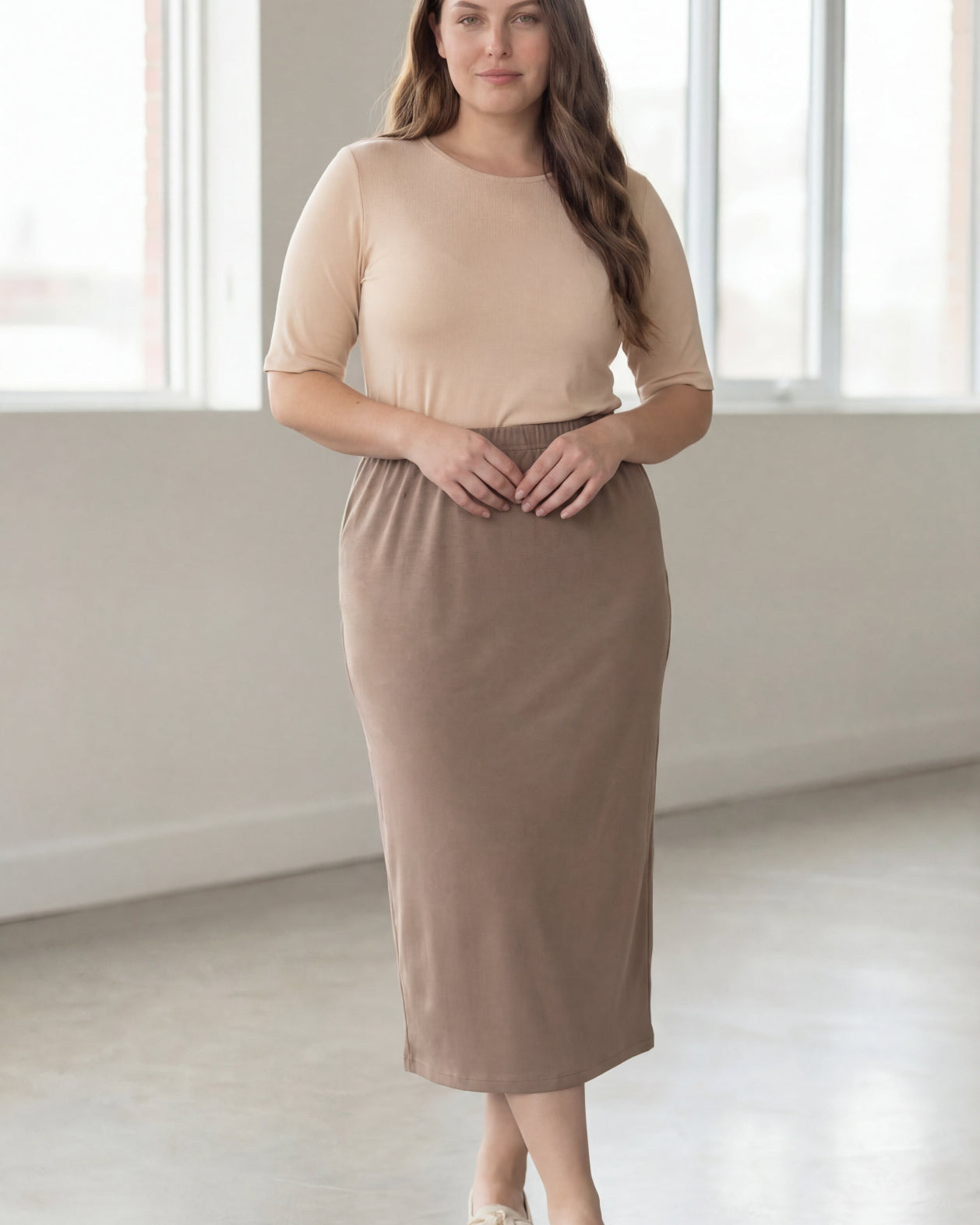 Model wearing Nuggles® 34" Classic Skirt in Taupe