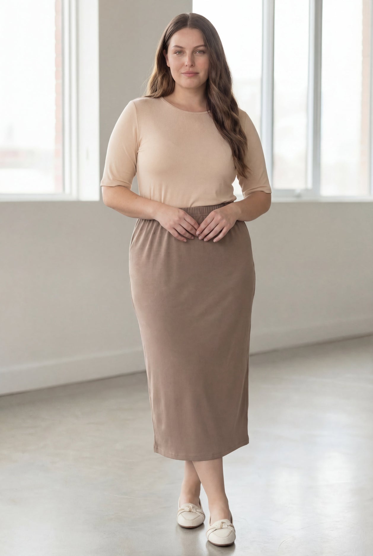 Model wearing Nuggles® 34" Classic Skirt in Taupe