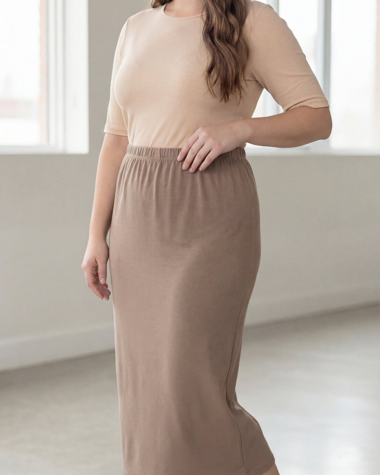 Model wearing Nuggles® 34" Classic Skirt in Taupe