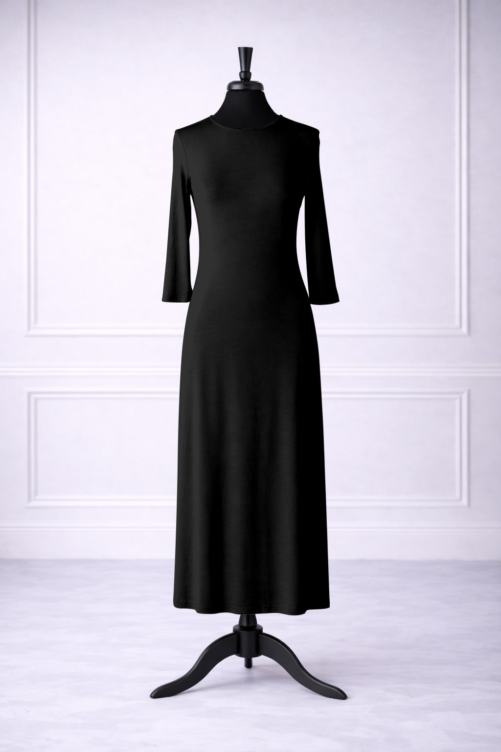 Front view of Nuggles® tea-length layering dress in Black