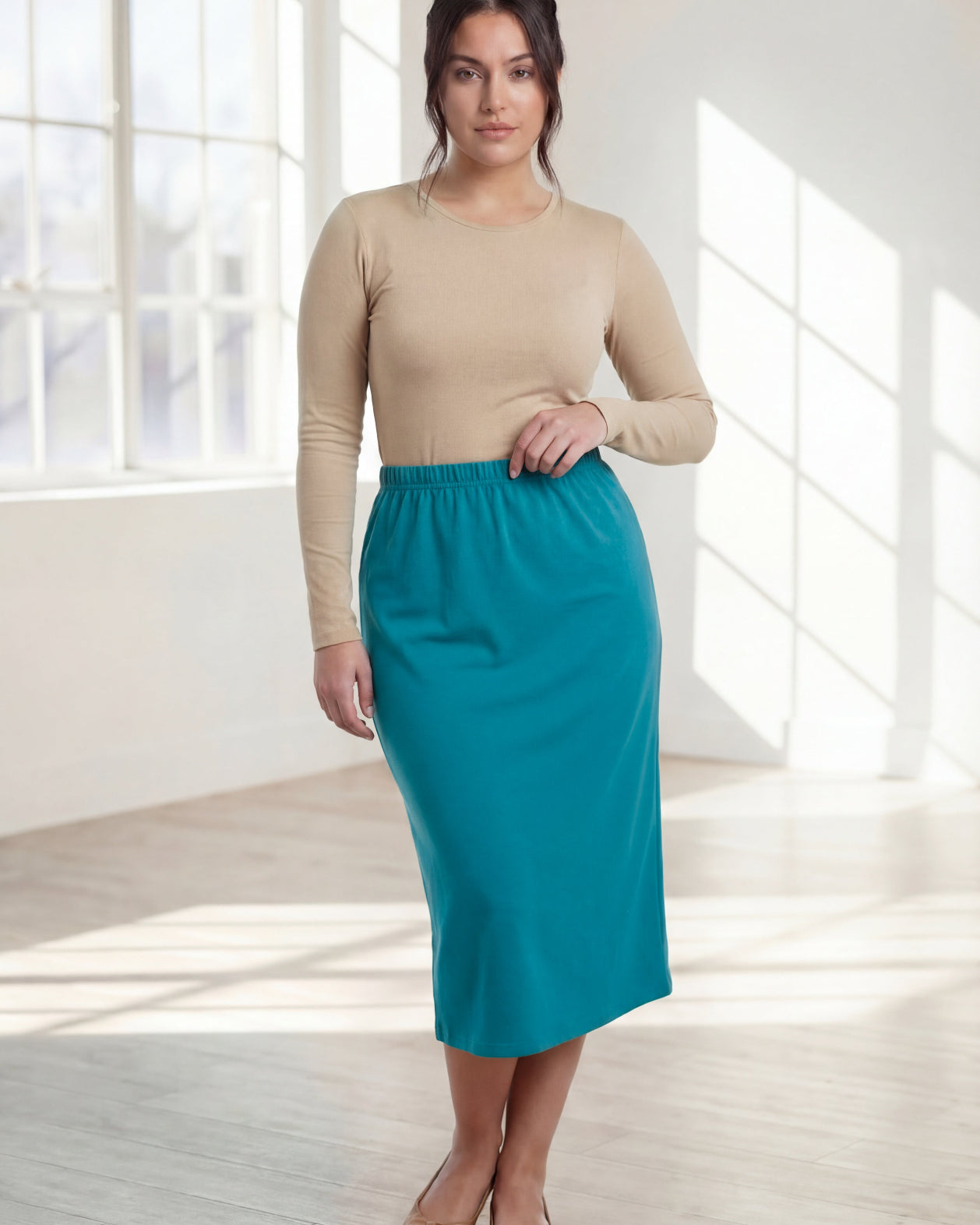 Model wearing Nuggles® 31" Classic Skirt in Teal