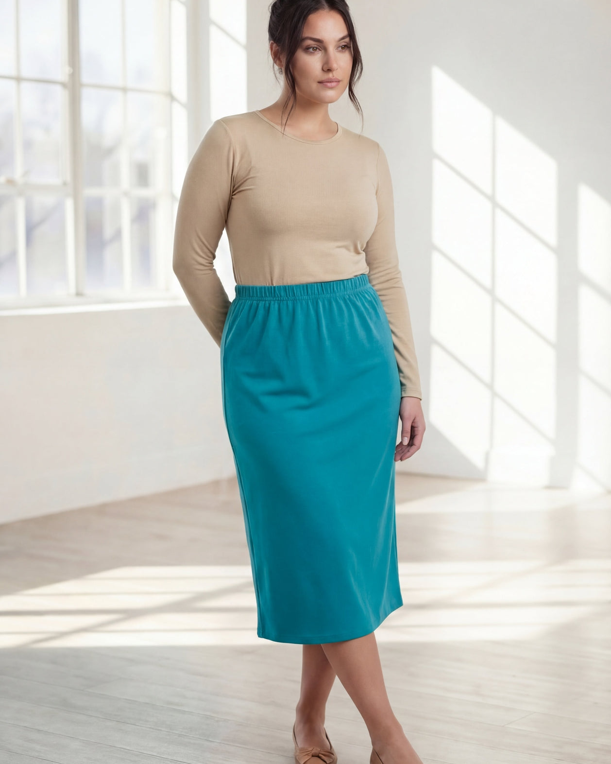 Model wearing Nuggles® 31" Classic Skirt in Teal