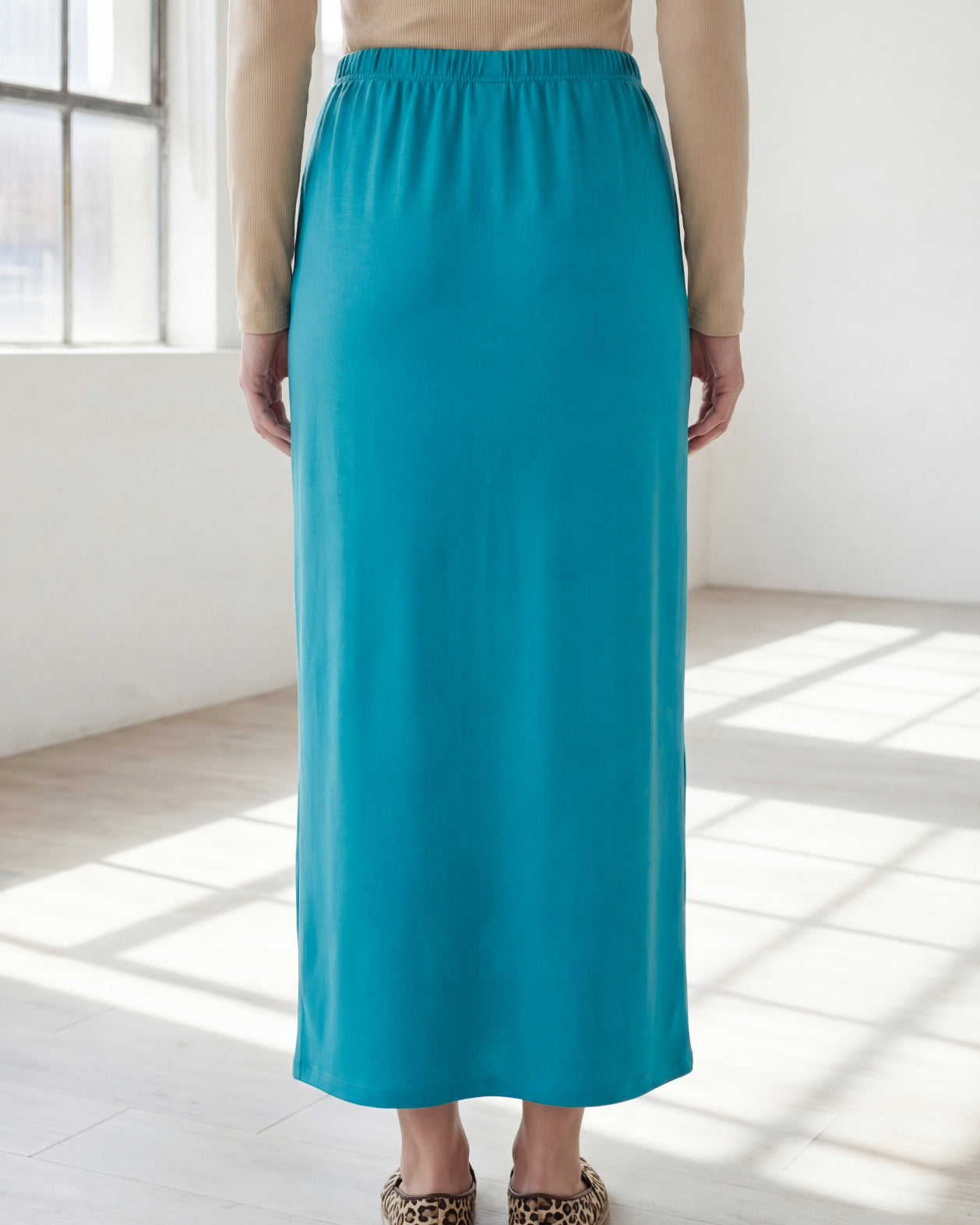 Model wearing Nuggles® 36" Classic Skirt in Teal