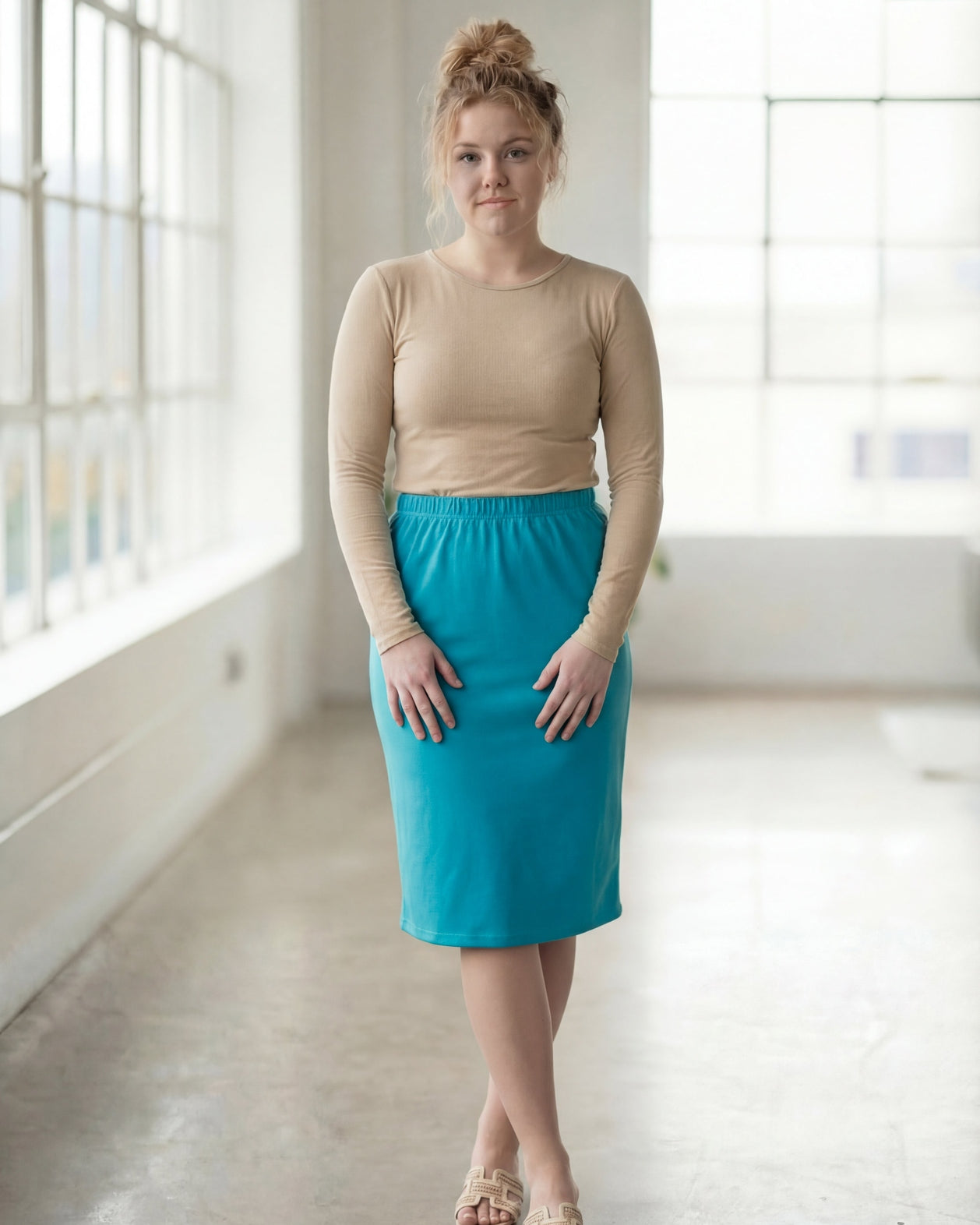 Model wearing Nuggles® 27" Classic Skirt in Teal