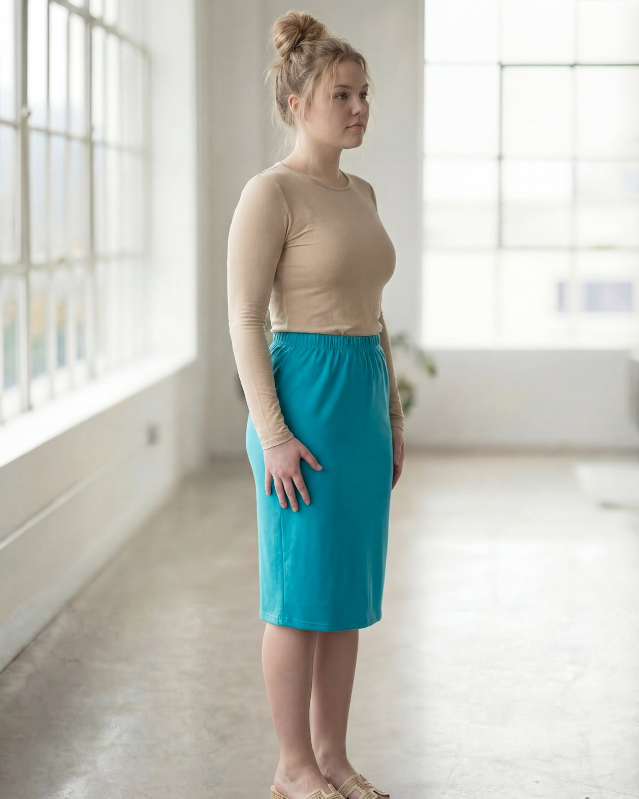 Model wearing Nuggles® 27" Classic Skirt in Teal