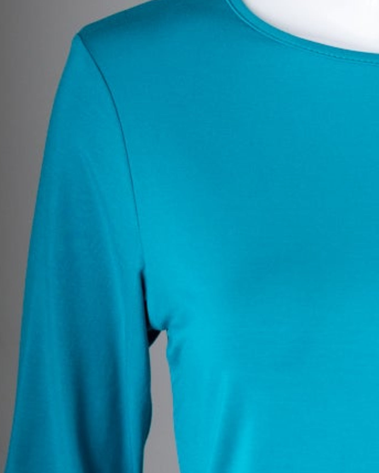 Model wearing Nuggles® 3/4 Essential Tee in Teal