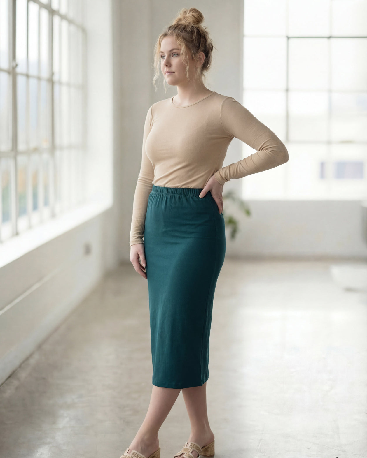 Model wearing Nuggles® 27" Classic Skirt in Teal Green
