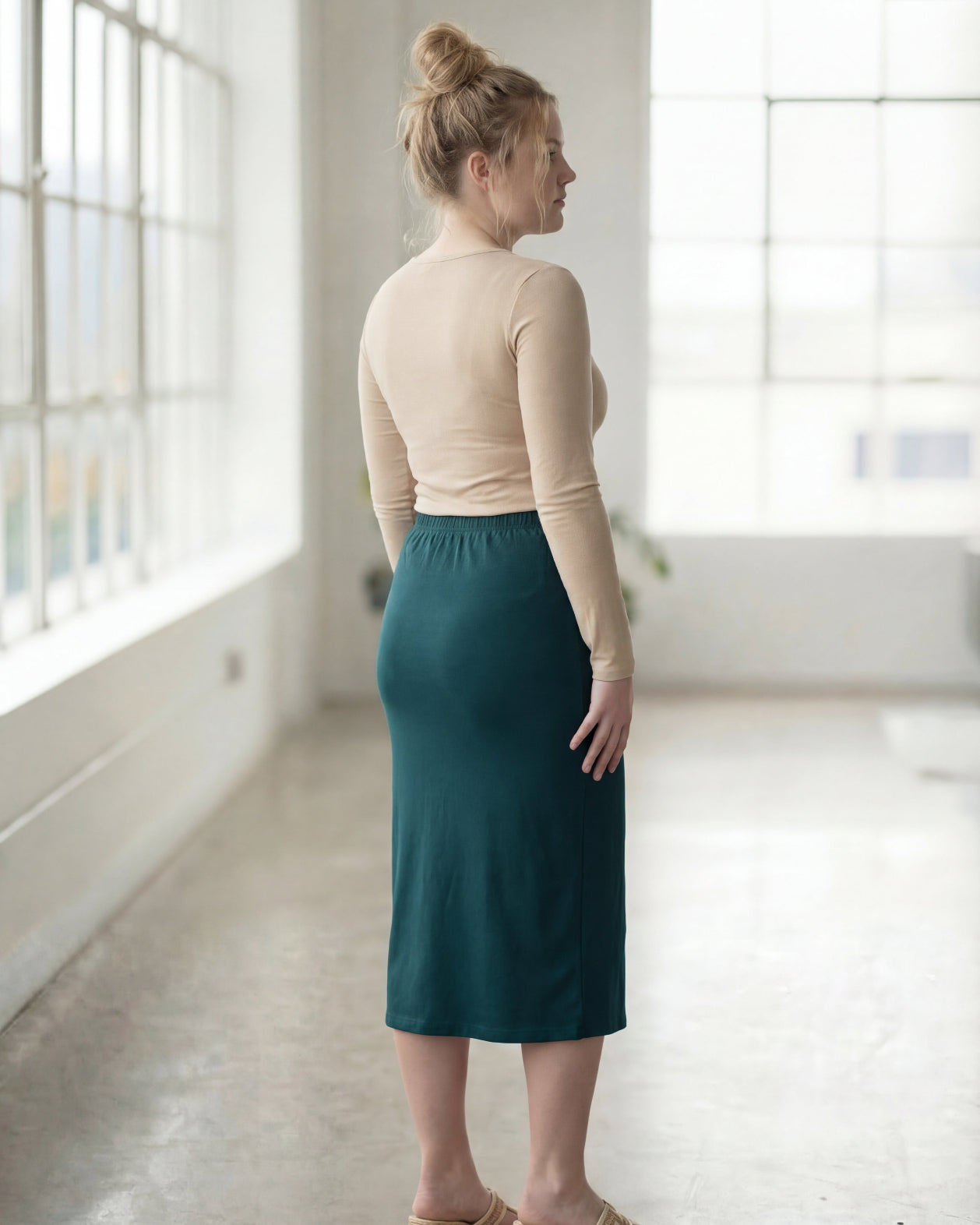 Model wearing Nuggles® 27" Classic Skirt in Teal Green