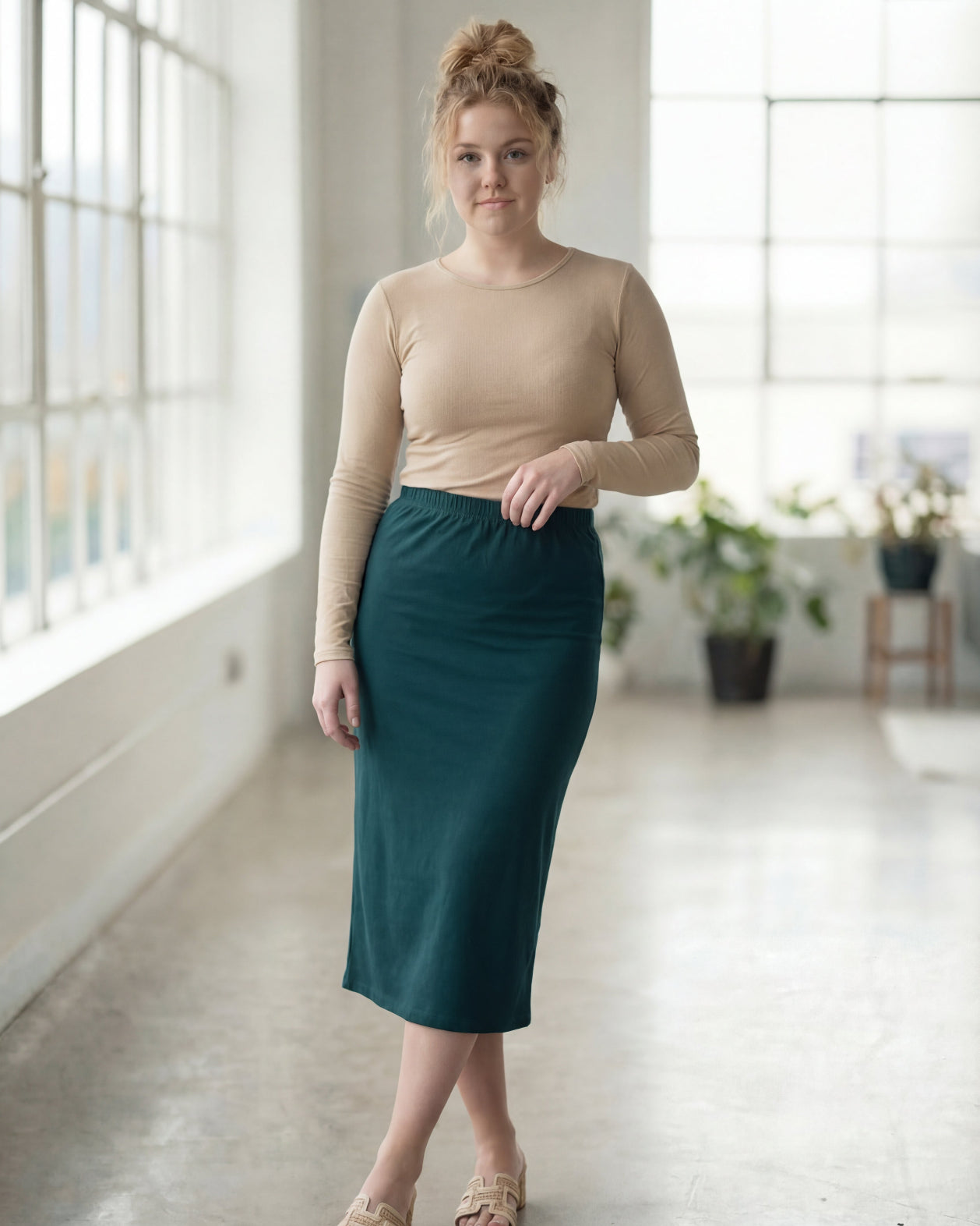 Model wearing Nuggles® 27" Classic Skirt in Teal Green