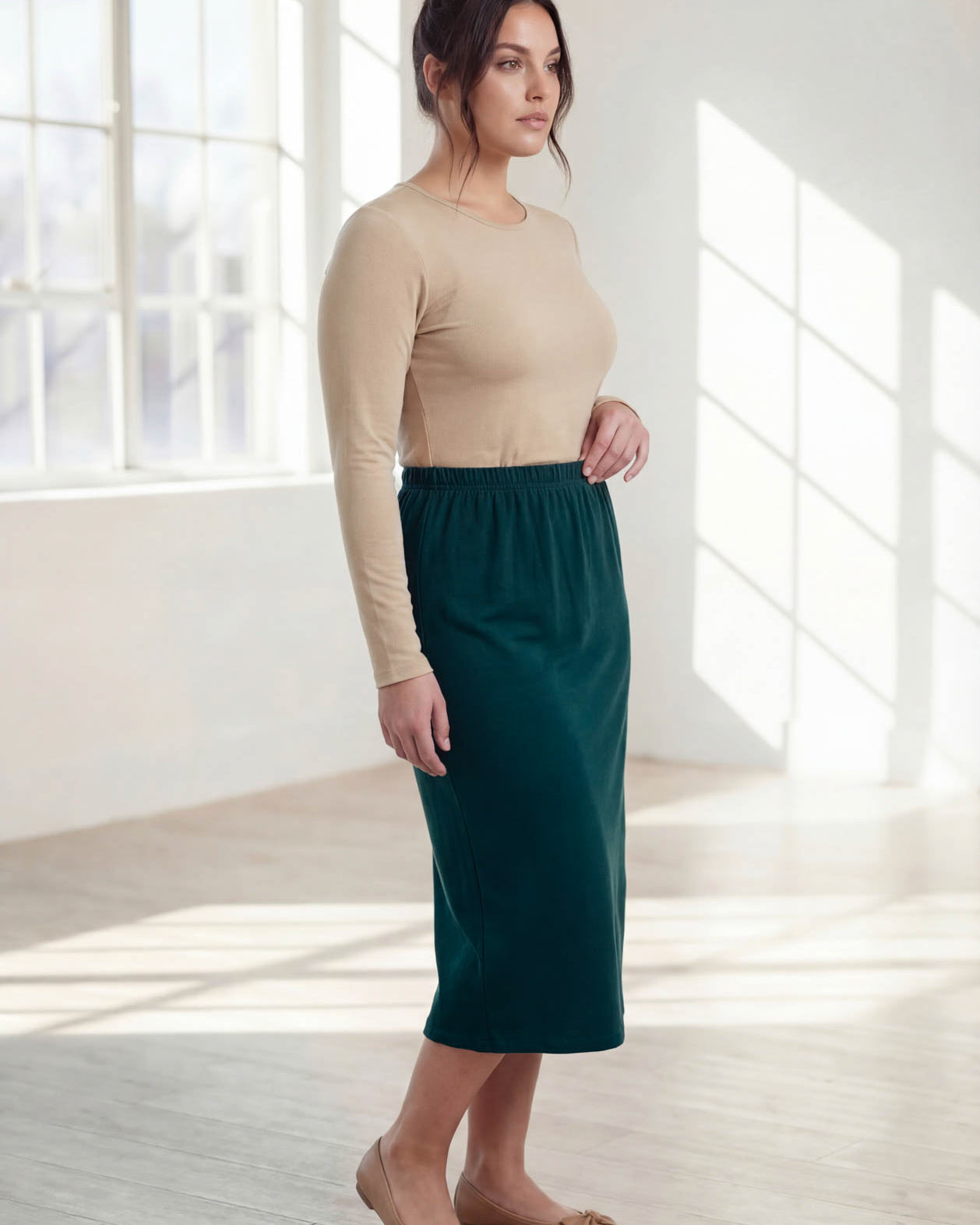 Model wearing Nuggles® 31" Classic Skirt in Teal Green