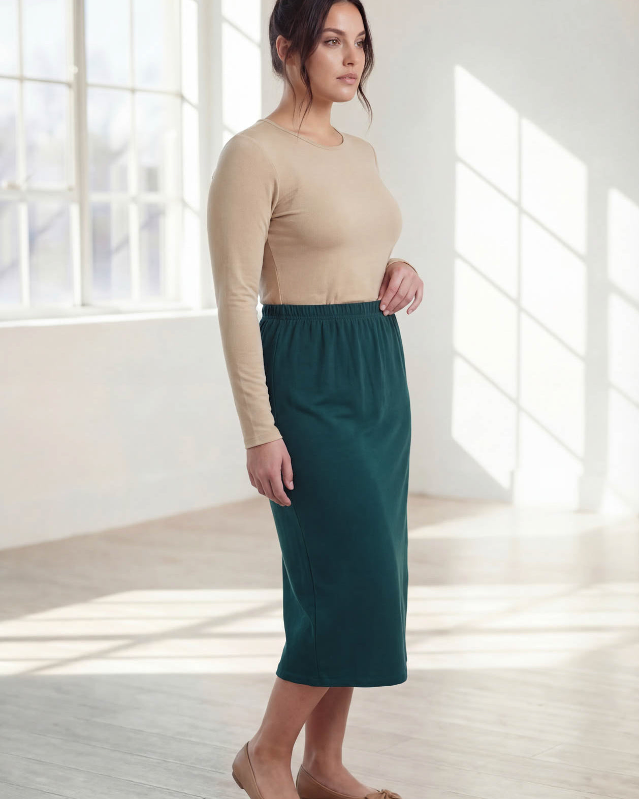 Model wearing Nuggles® 31" Classic Skirt in Teal Green