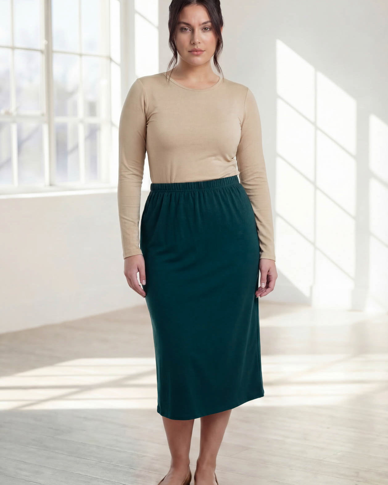 Model wearing Nuggles® 31" Classic Skirt in Teal Green