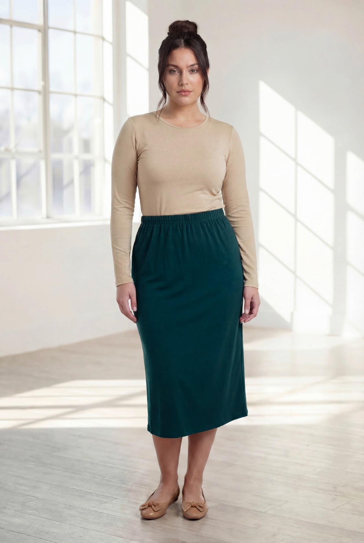 Model wearing Nuggles® 31" Classic Skirt in Teal Green