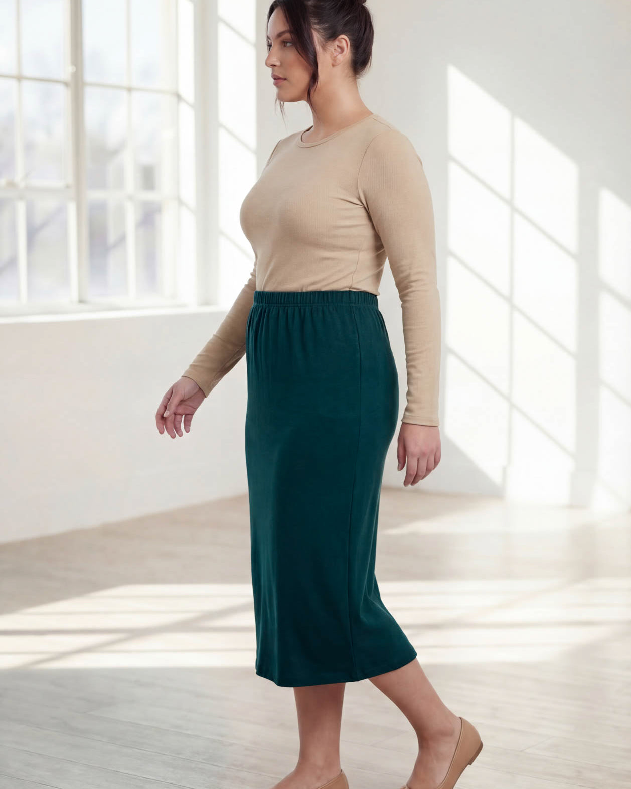 Model wearing Nuggles® 31" Classic Skirt in Teal Green