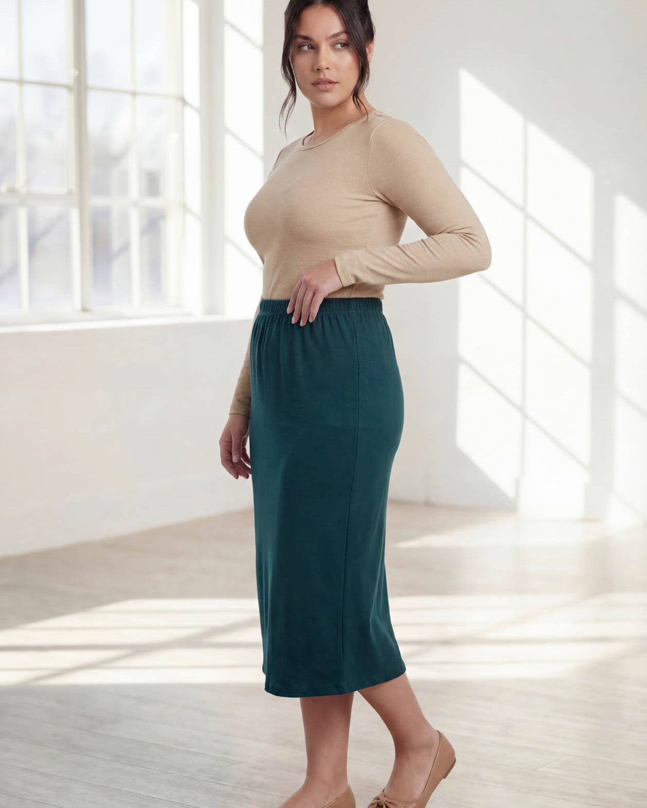 Model wearing Nuggles® 31" Classic Skirt in Teal Green