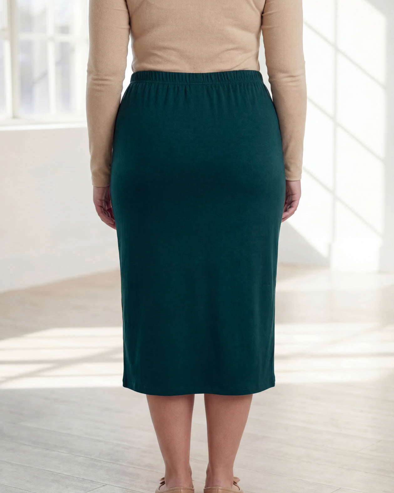 Model wearing Nuggles® 31" Classic Skirt in Teal Green