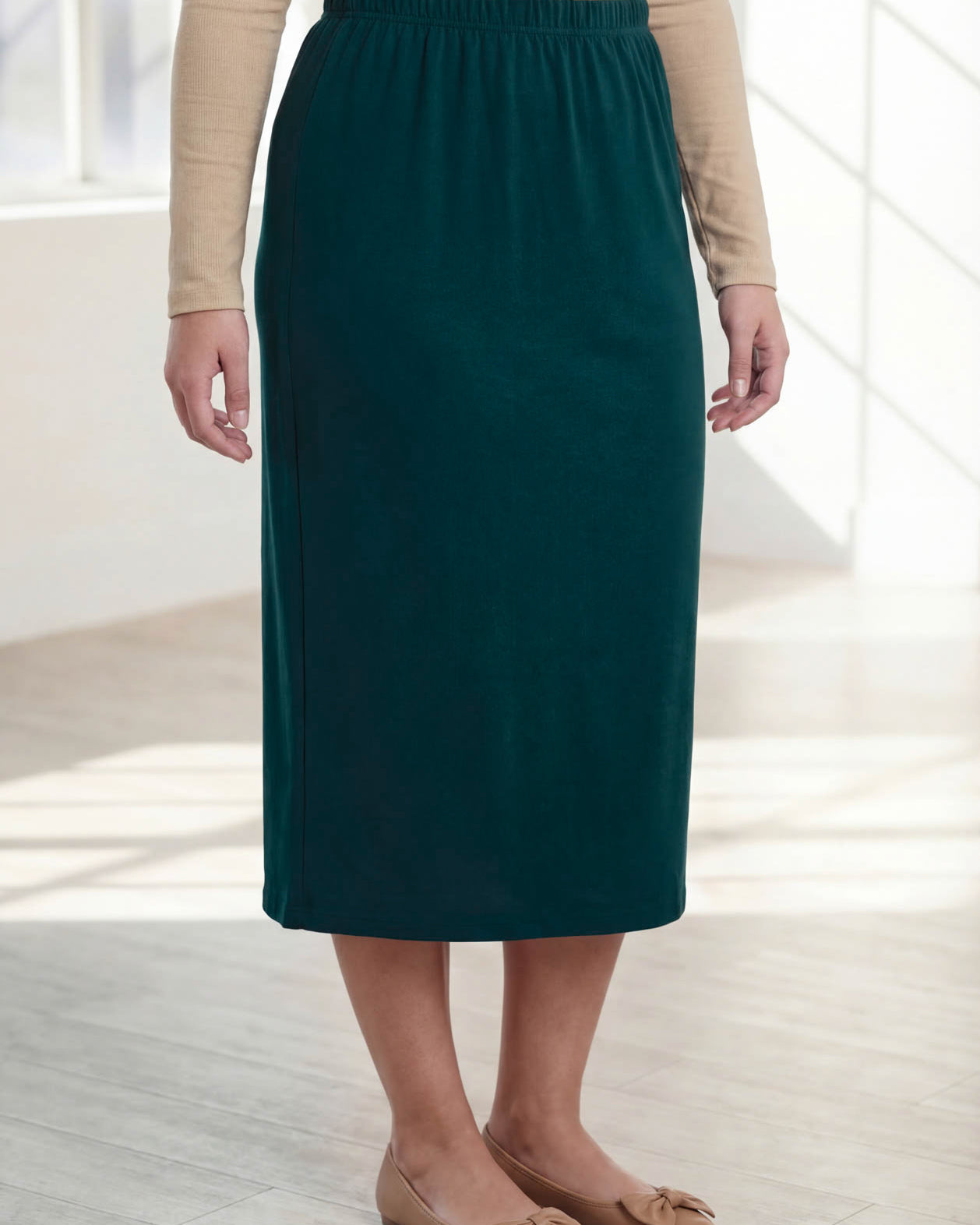 Model wearing Nuggles® 31" Classic Skirt in Teal Green