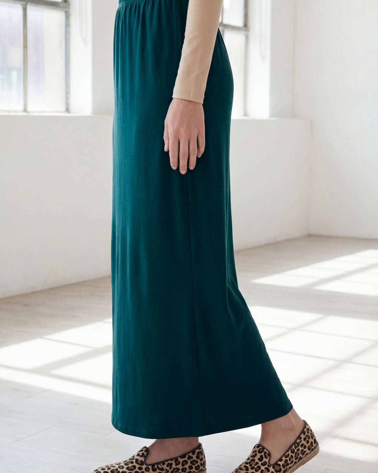 Model wearing Nuggles® 36" Classic Skirt in Teal Green
