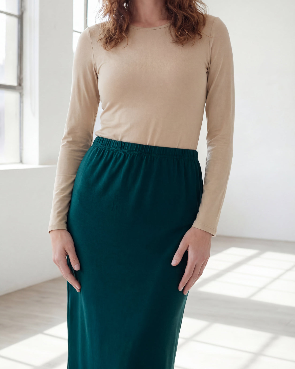 Model wearing Nuggles® 36" Classic Skirt in Teal Green