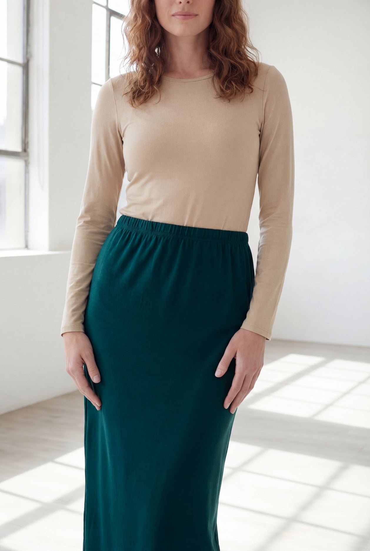 Model wearing Nuggles® 36" Classic Skirt in Teal Green
