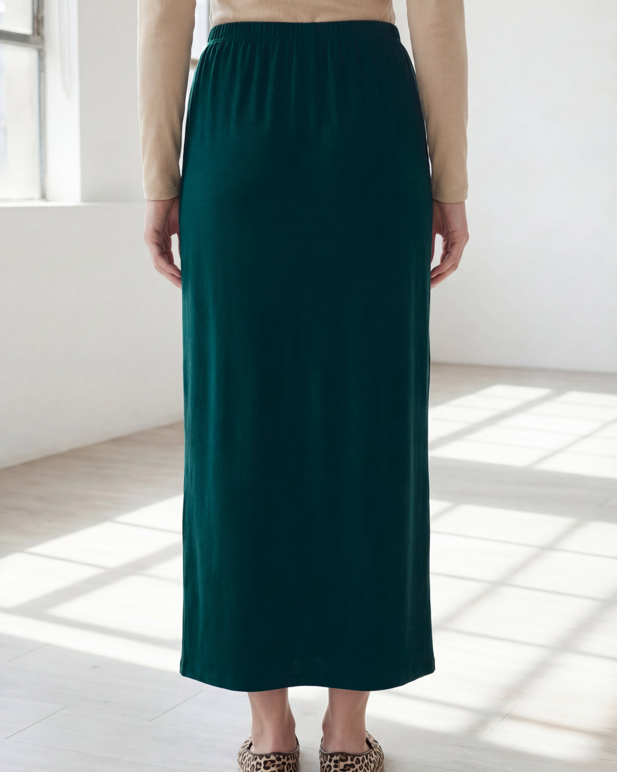 Model wearing Nuggles® 36" Classic Skirt in Teal Green