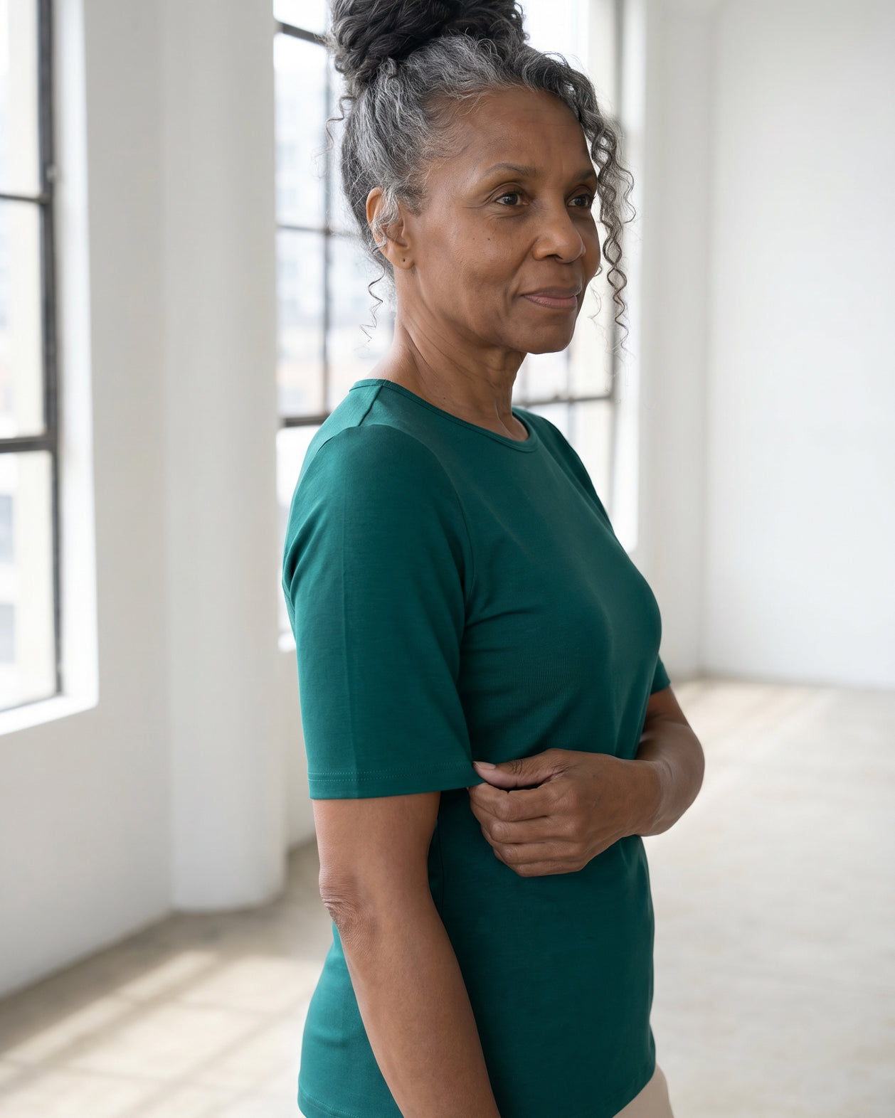 Model wearing Nuggles® Half Sleeve Essential Tee in Teal Green