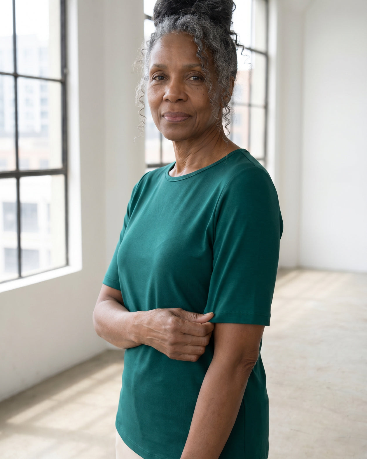 Model wearing Nuggles® Half Sleeve Essential Tee in Teal Green