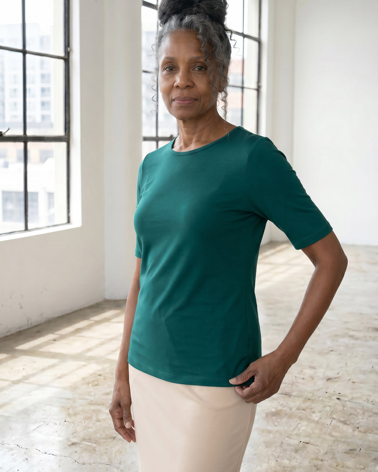 Model wearing Nuggles® Half Sleeve Essential Tee in Teal Green