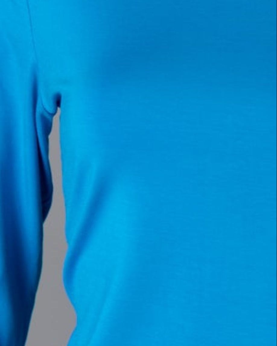 Model wearing Nuggles® 3/4 Essential Tee in Turquoise