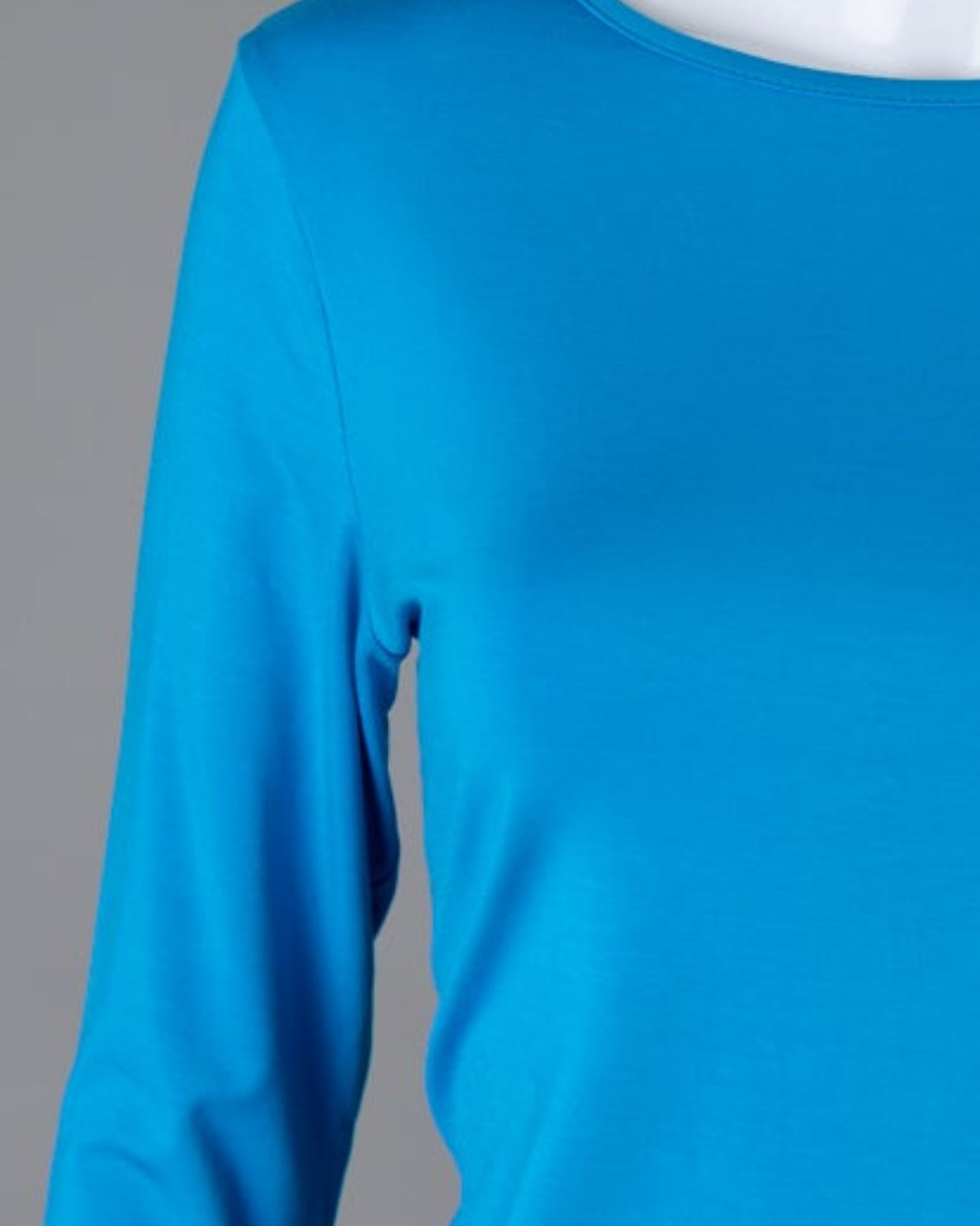 Model wearing Nuggles® 3/4 Essential Tee in Turquoise