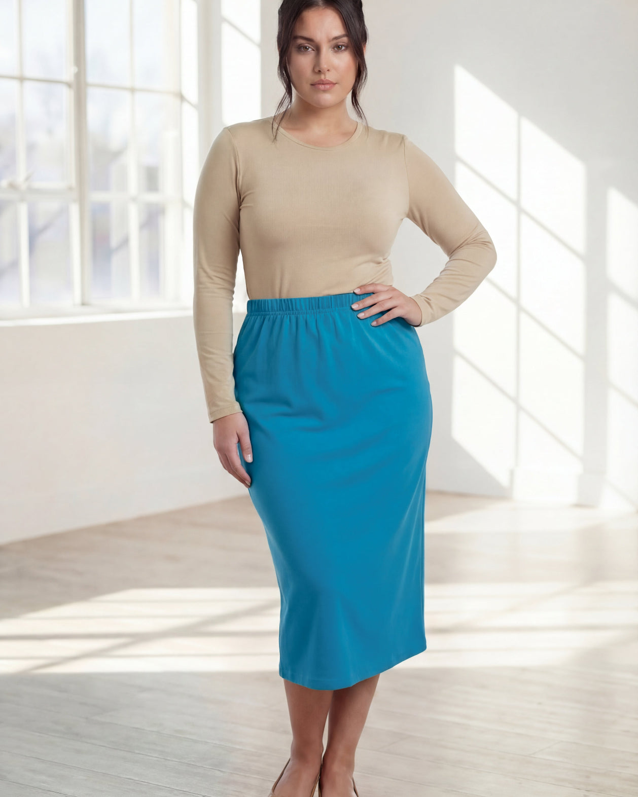 Model wearing Nuggles® 31" Classic Skirt in Turquoise