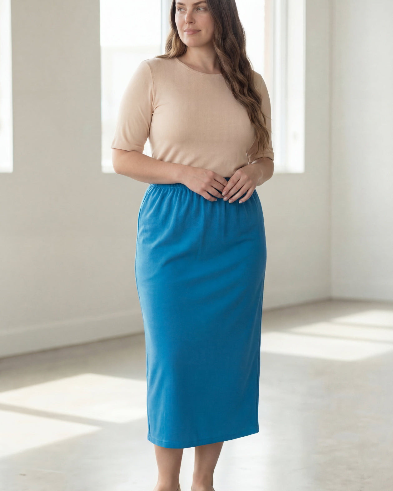 Model wearing Nuggles® 34" Classic Skirt in Turquoise