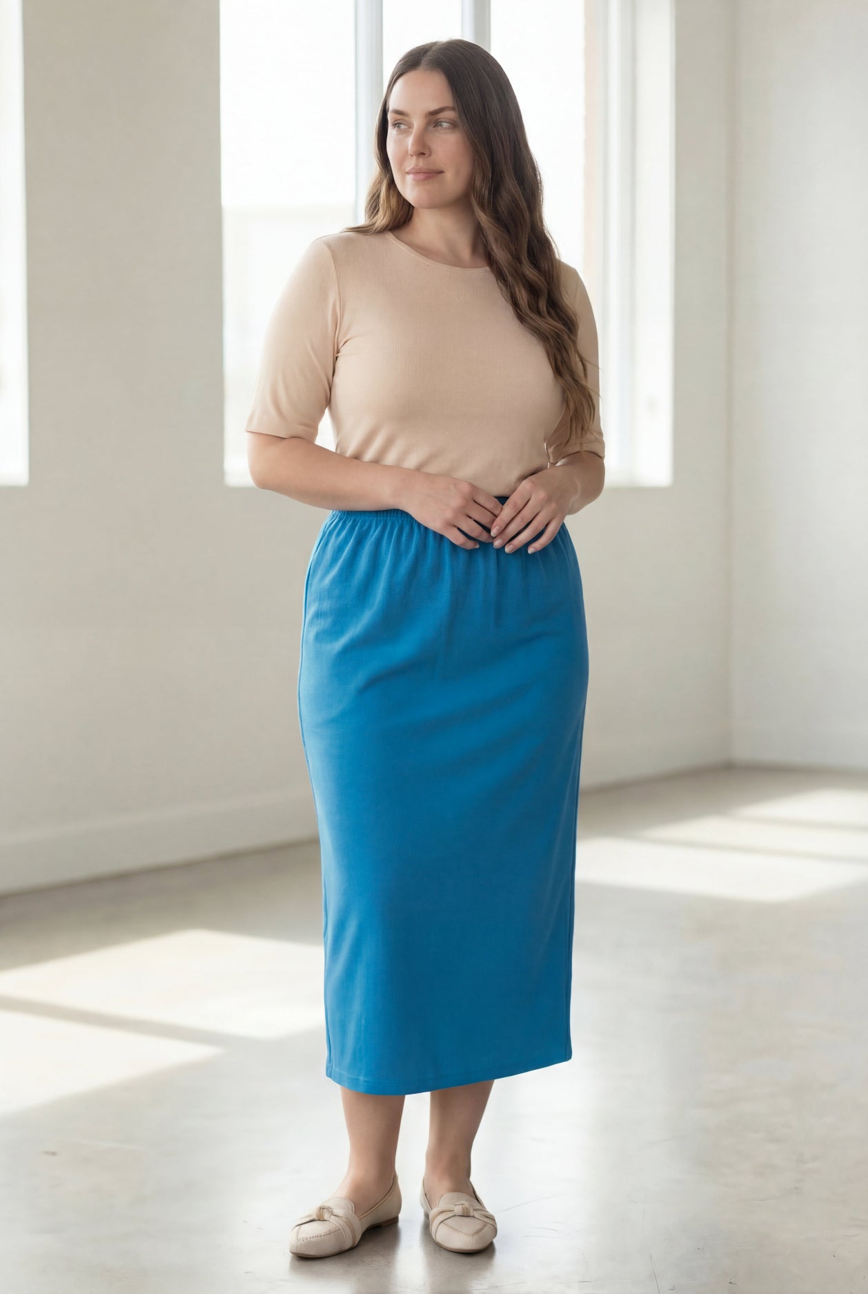 Model wearing Nuggles® 34" Classic Skirt in Turquoise