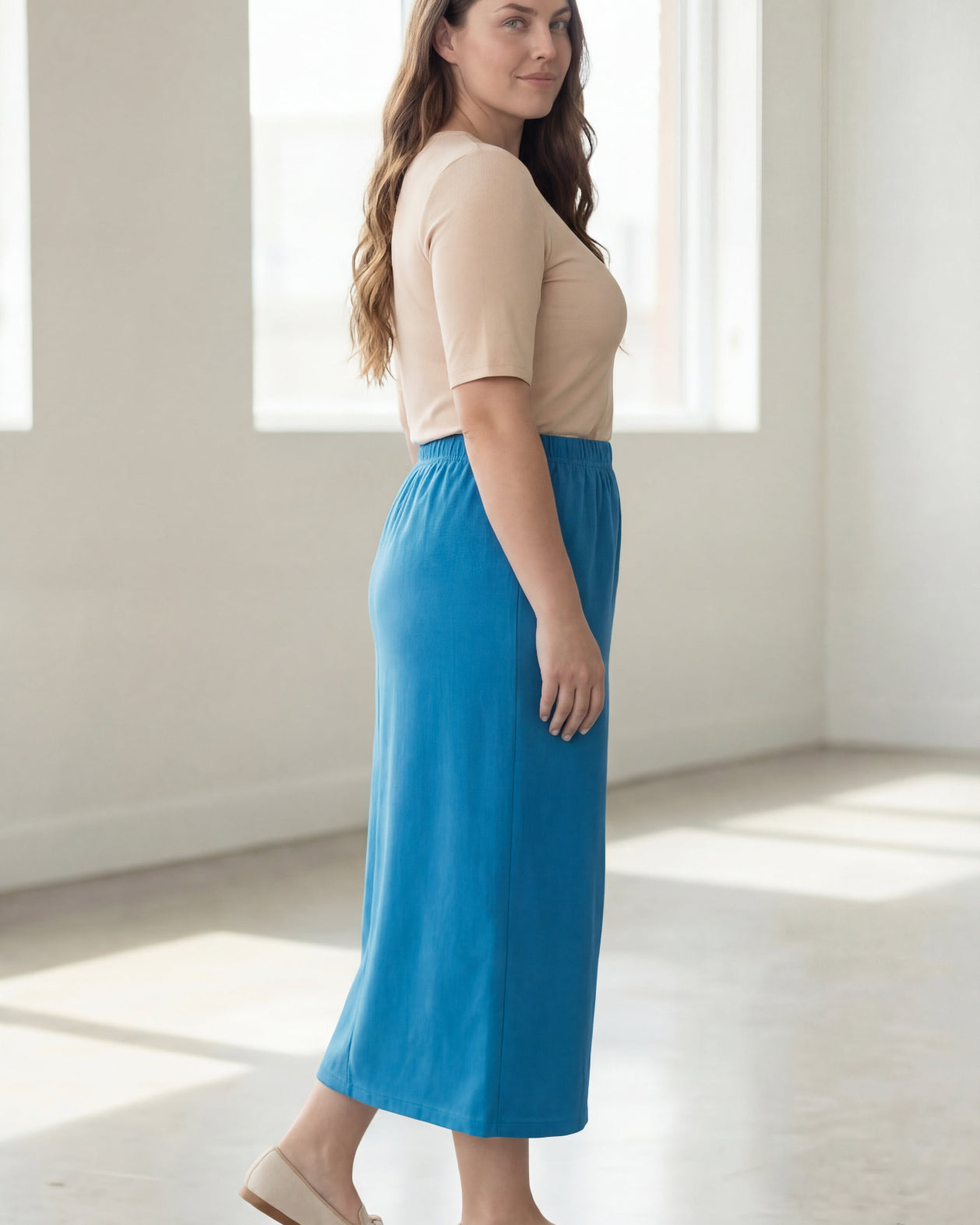 Model wearing Nuggles® 34" Classic Skirt in Turquoise