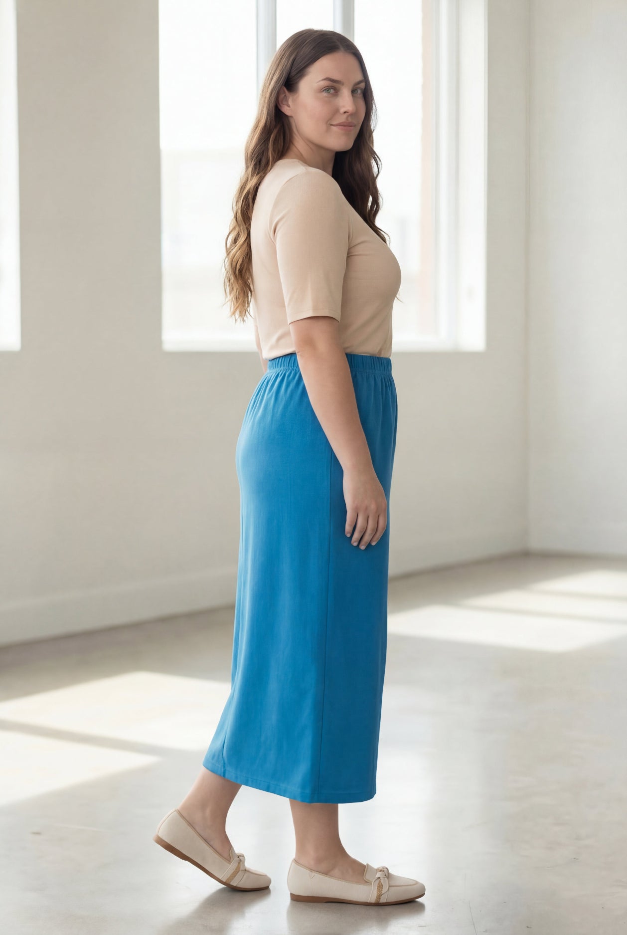 Model wearing Nuggles® 34" Classic Skirt in Turquoise