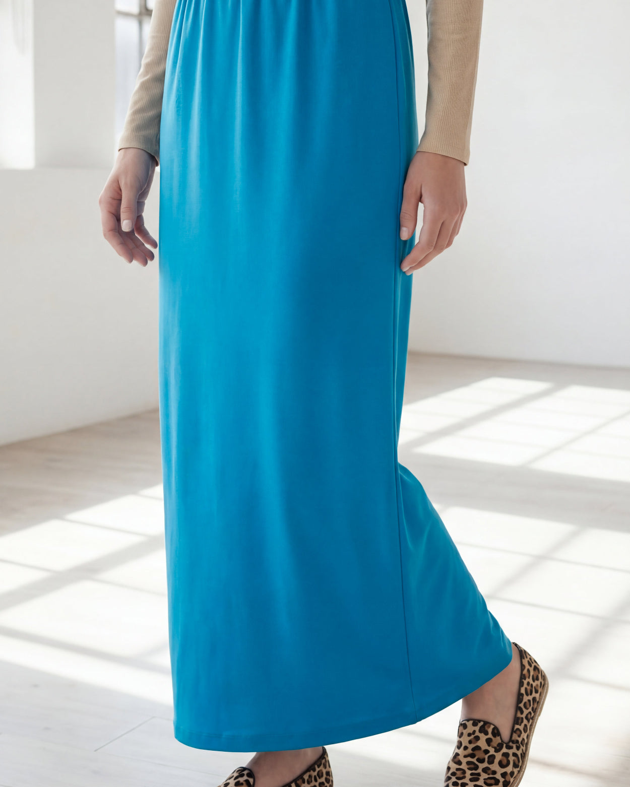 Model wearing Nuggles® 36" Classic Skirt in Turquoise