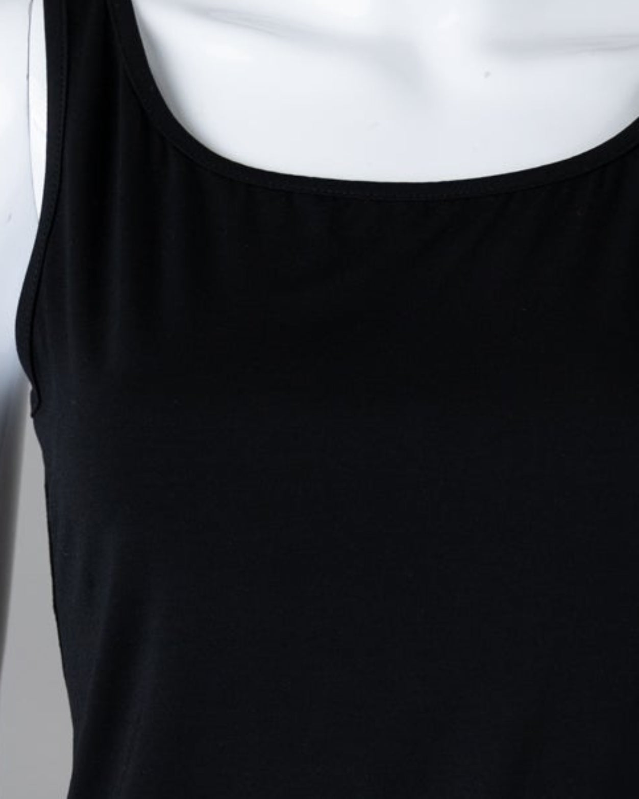 Model wearing Nuggles® Wide Neck Tank in Black