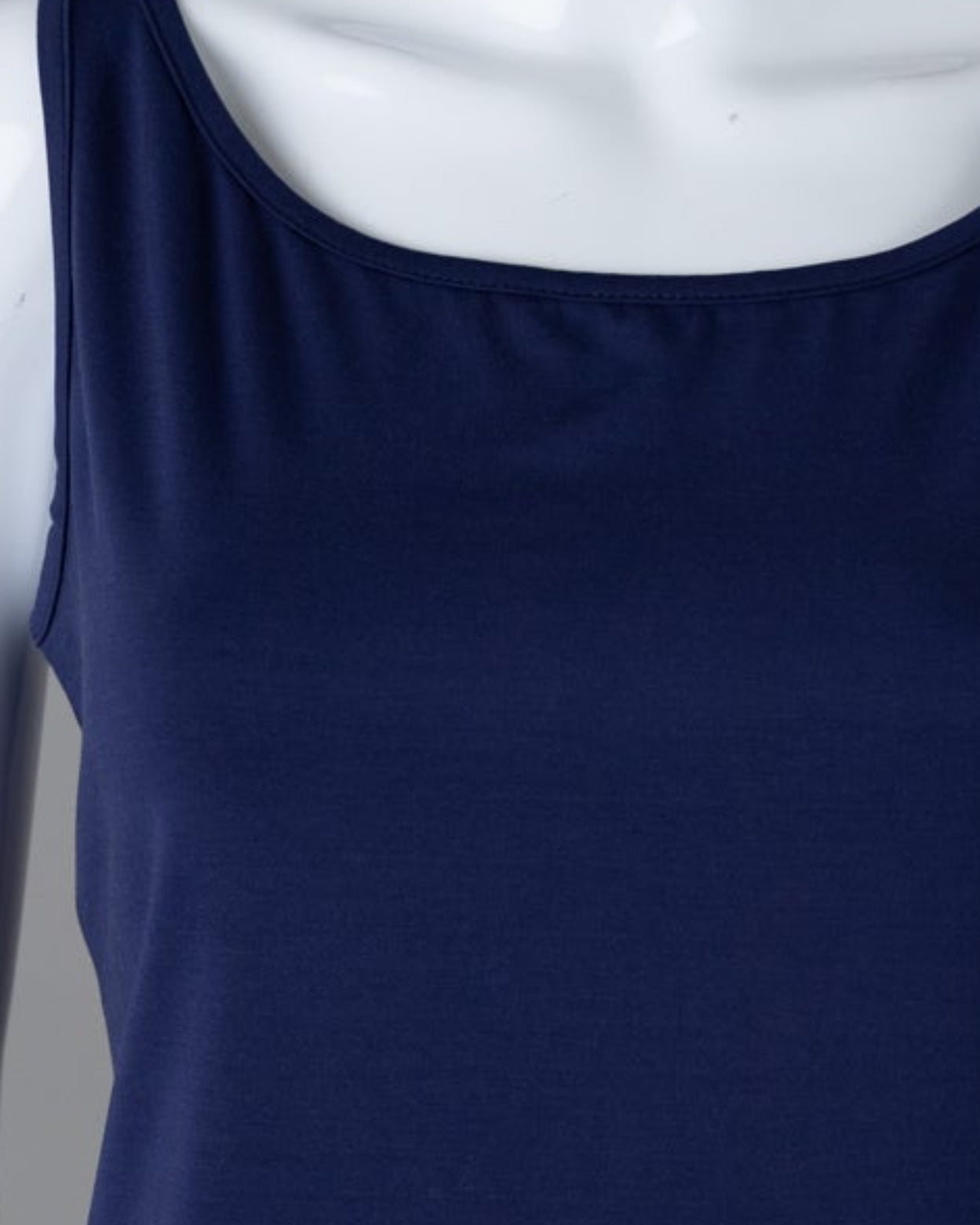 Model wearing Nuggles® Wide Neck Tank in Navy