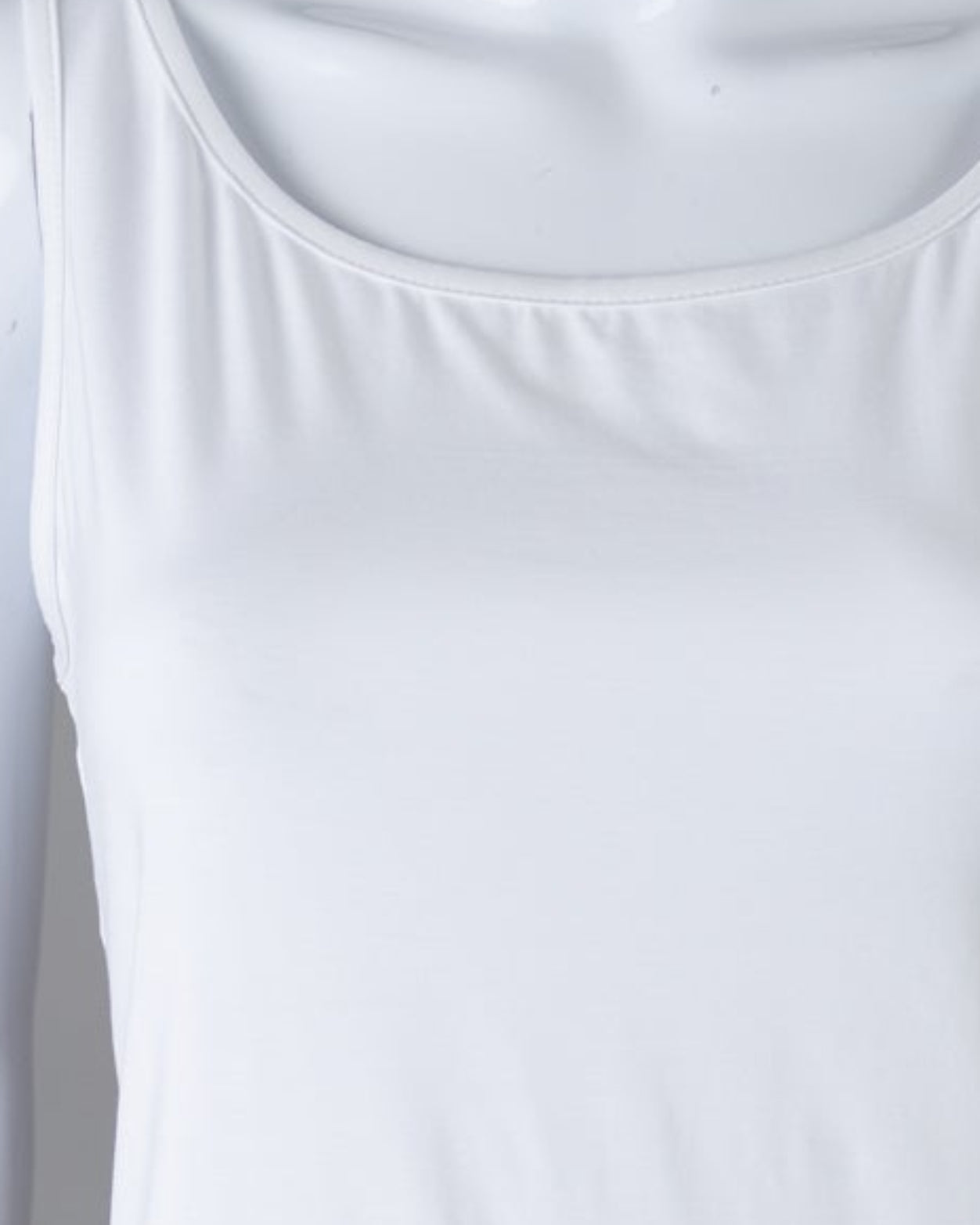 Model wearing Nuggles® Wide Neck Tank in White