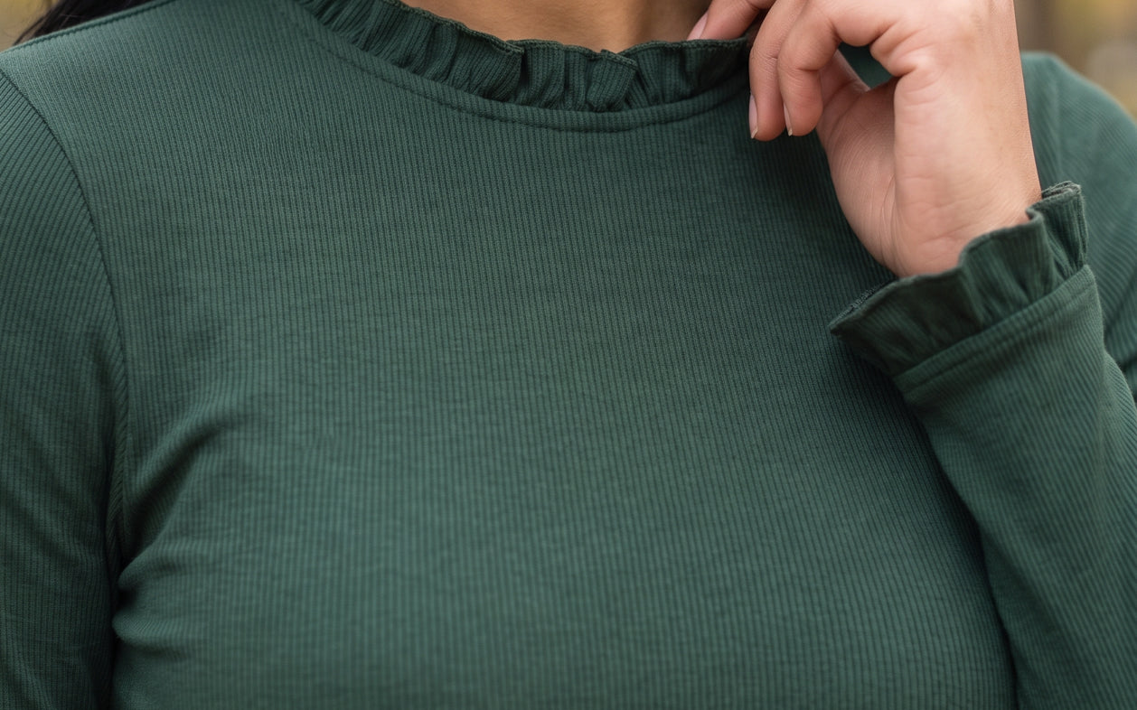 Woman wearing the modest Bethany ribbed long sleeve top and matching midi skirt in Pine Green for a fall outfit