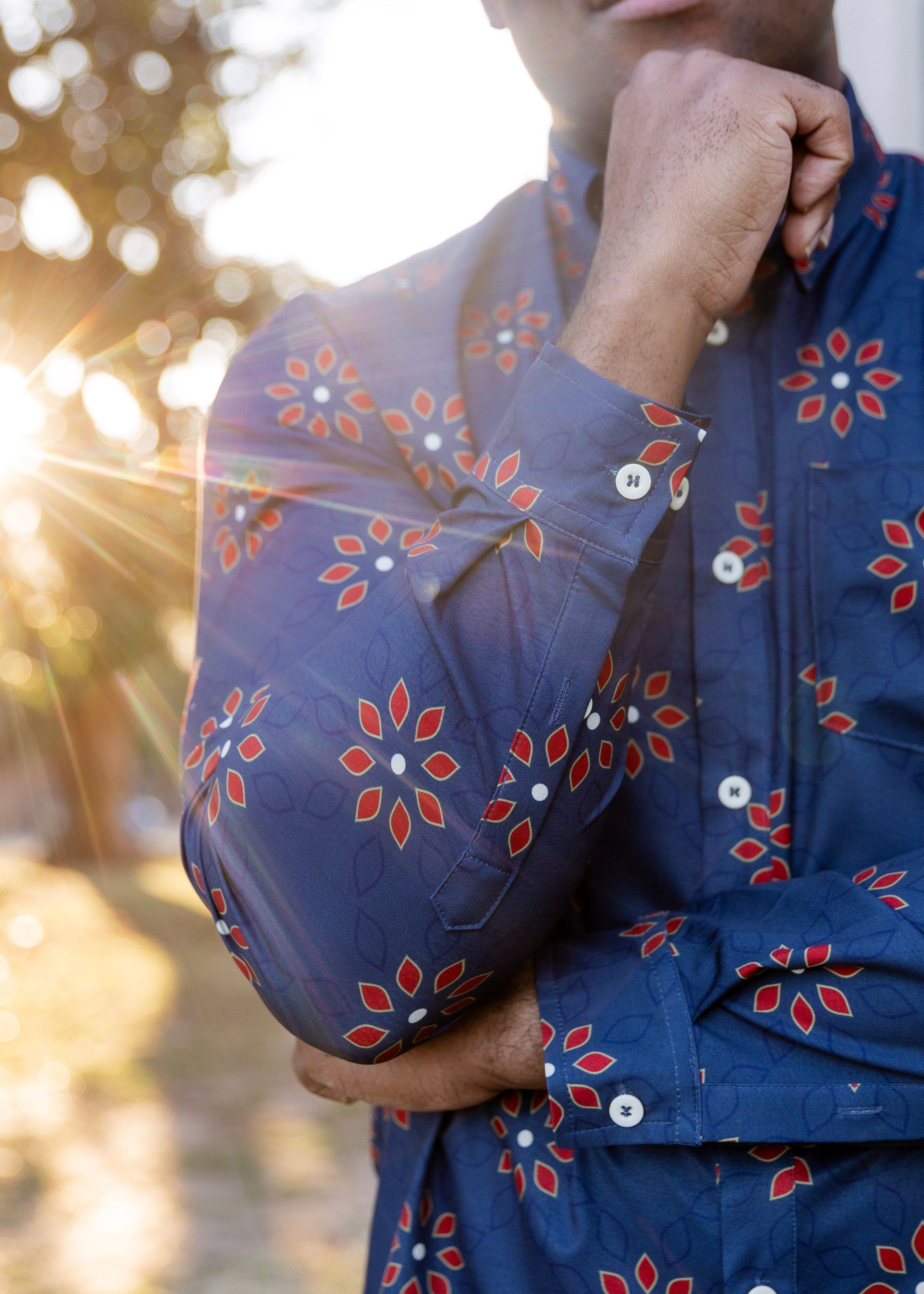 A modern classic skirt for men in red and blue floral. 