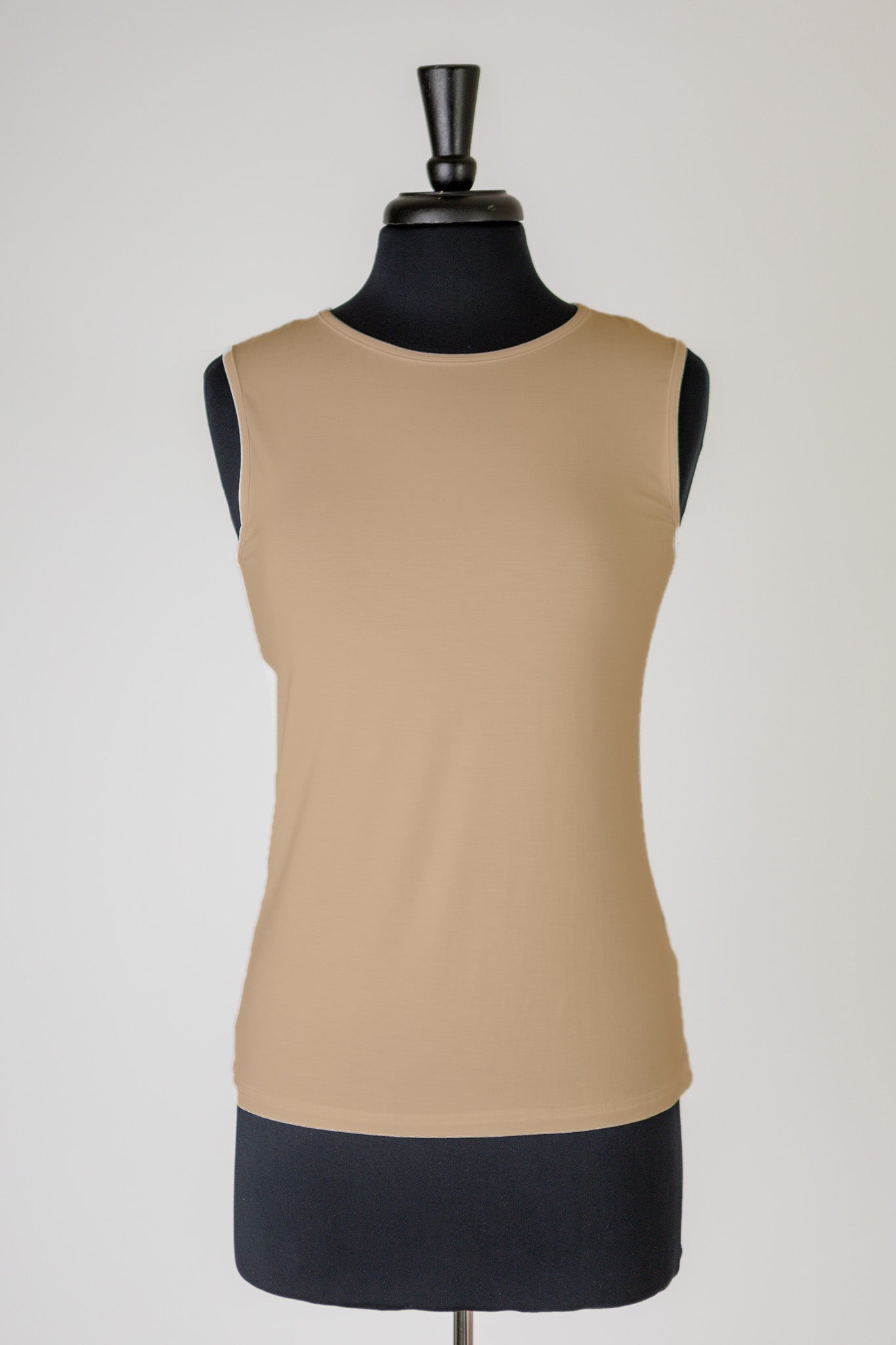 A mannequin with a khaki colored tank top with modest neck and torso coverage.