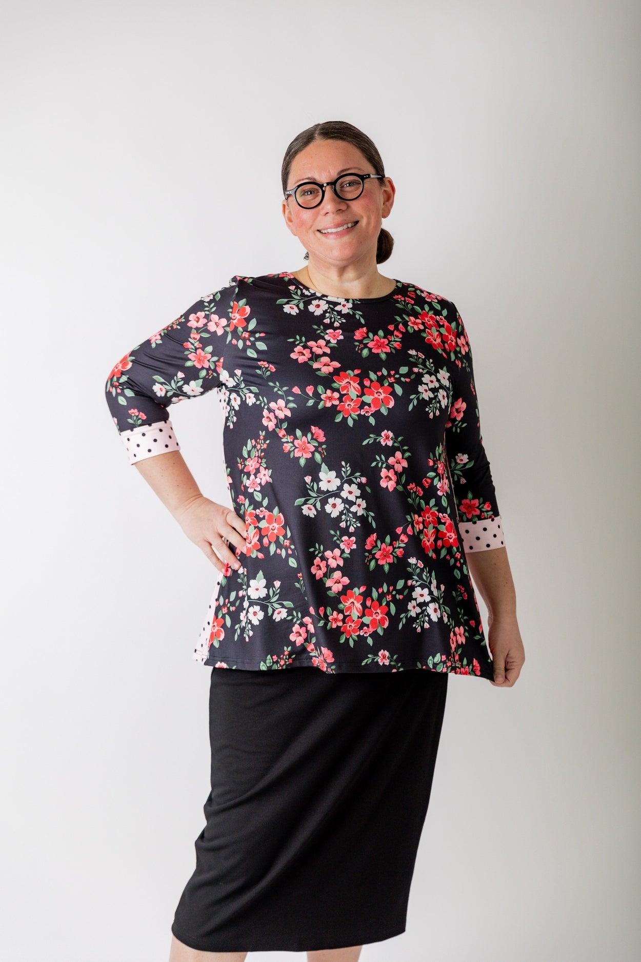 Woman wearing a modest, generous cut top from Nuggles that is available in plus sizes. 