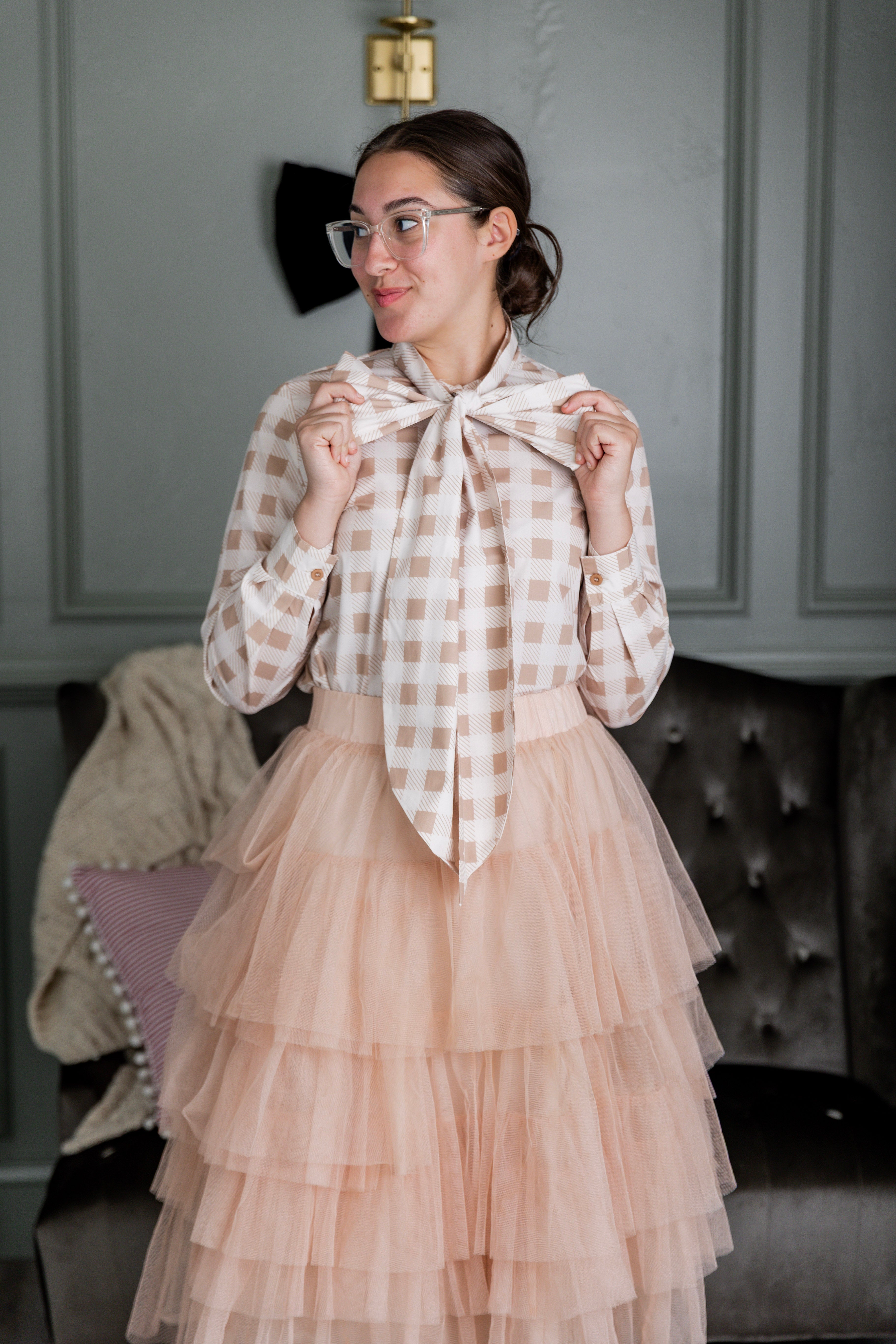 Women wearing a modest top in a beige and white print